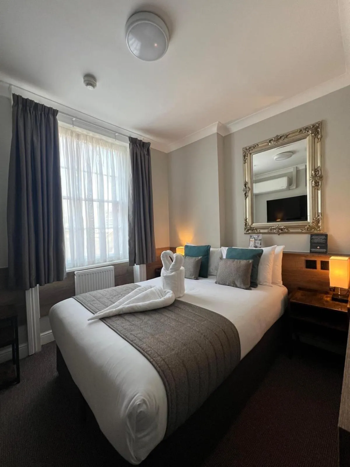 Bed in Tudor Court Hotel