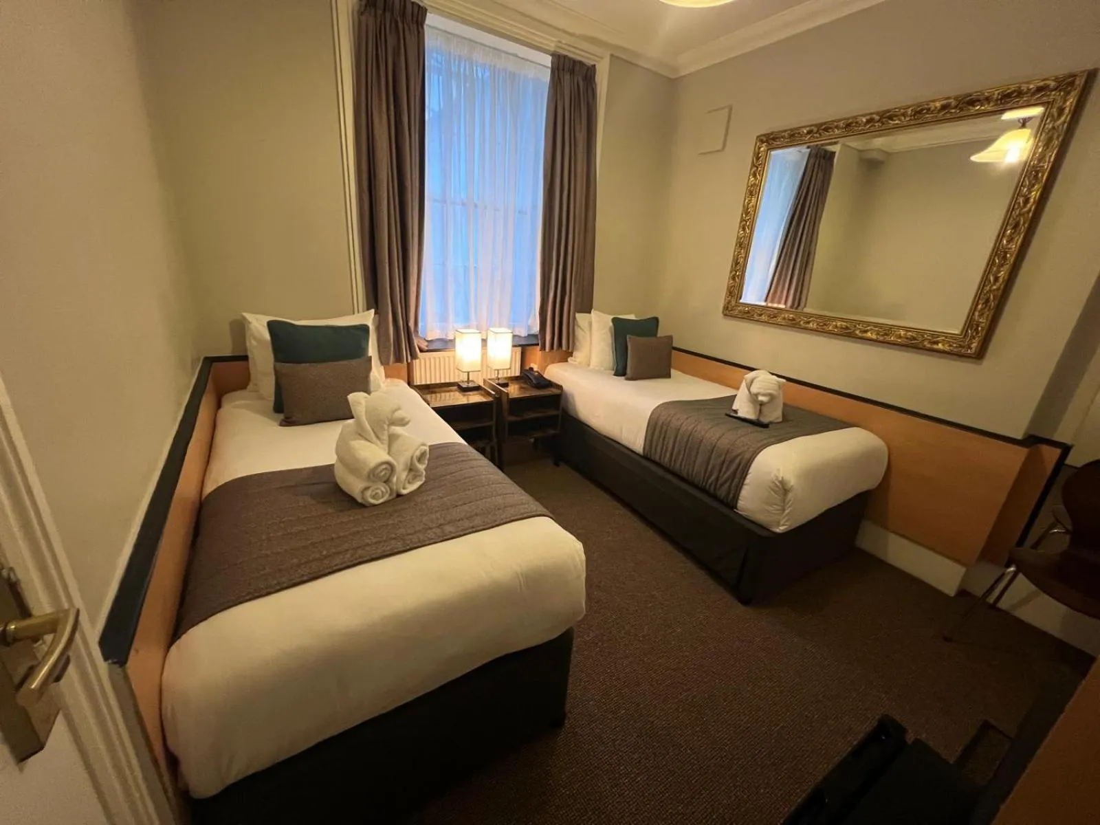 Bed in Tudor Court Hotel