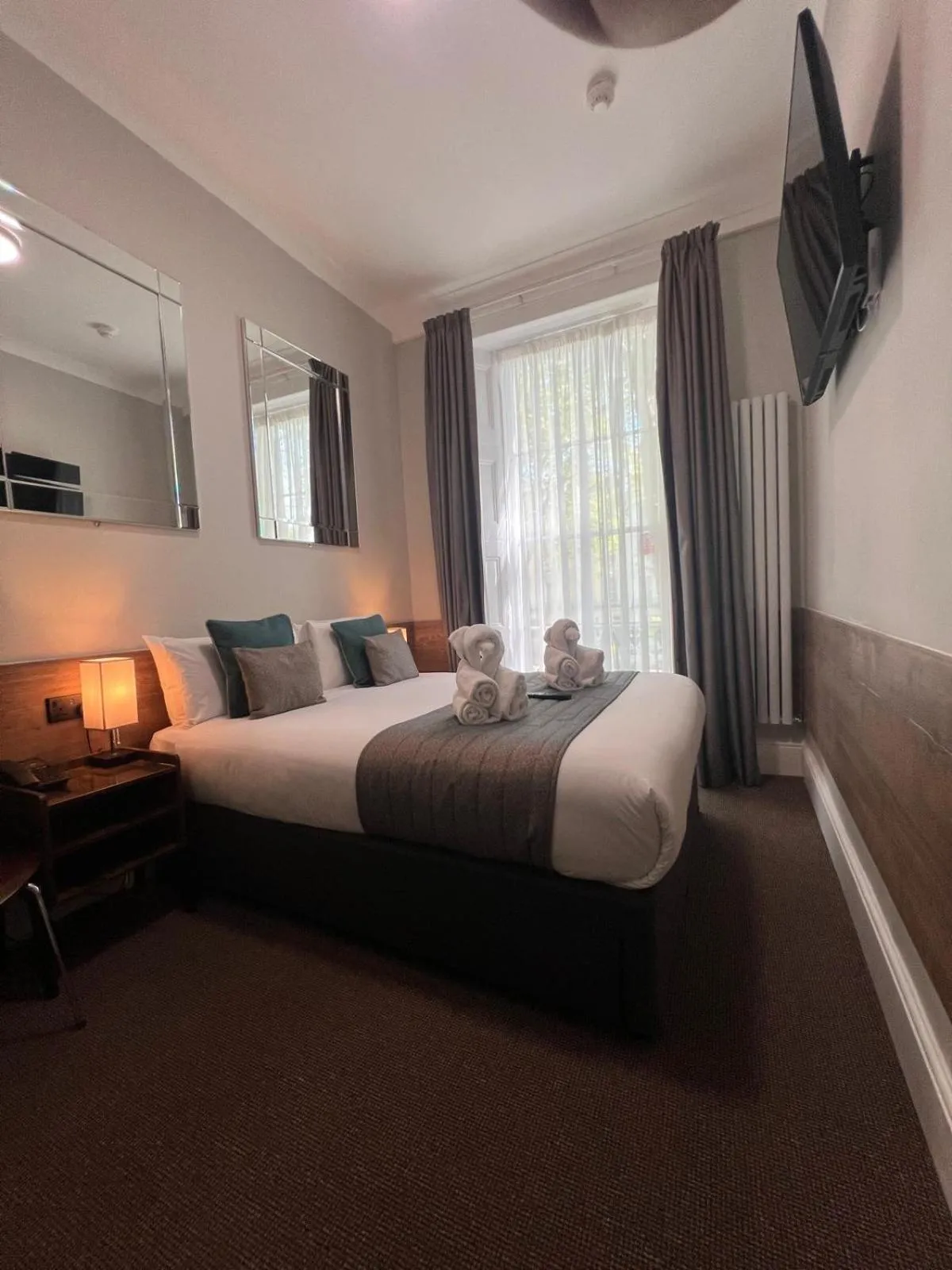 Bed in Tudor Court Hotel