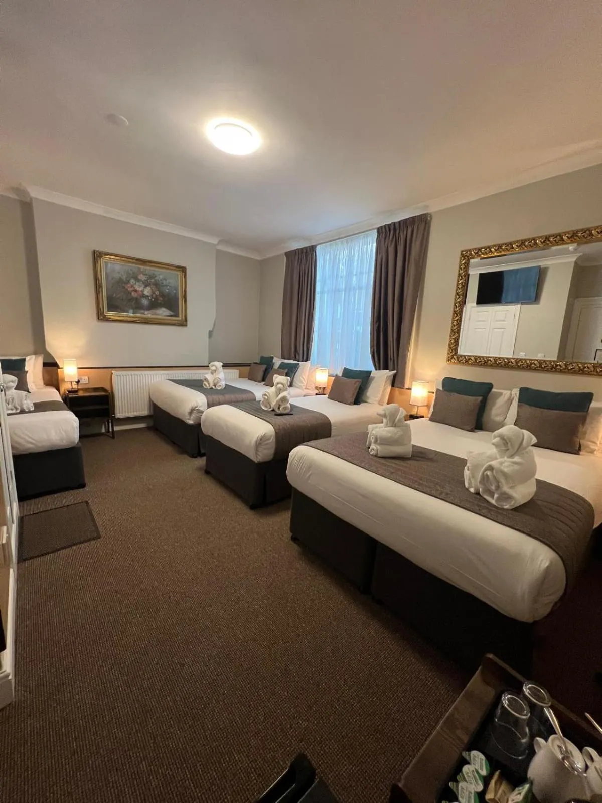 Bed in Tudor Court Hotel