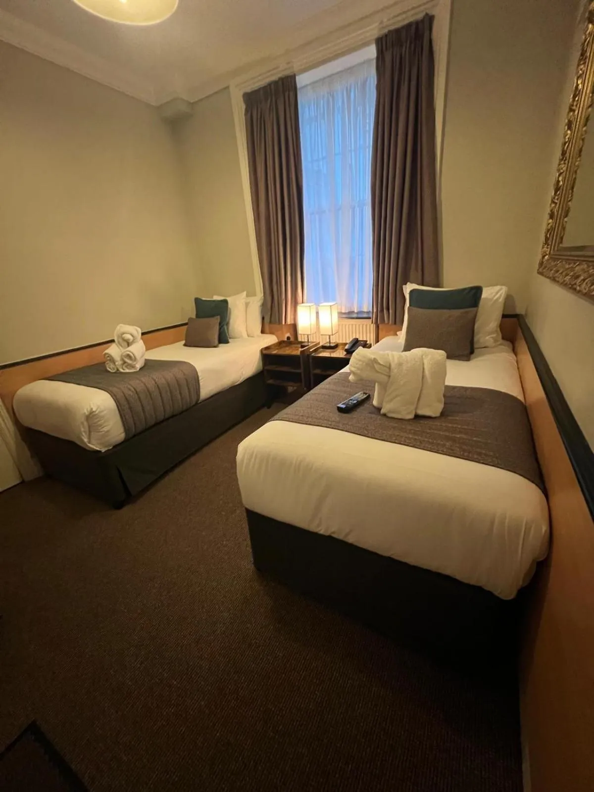 Bed in Tudor Court Hotel