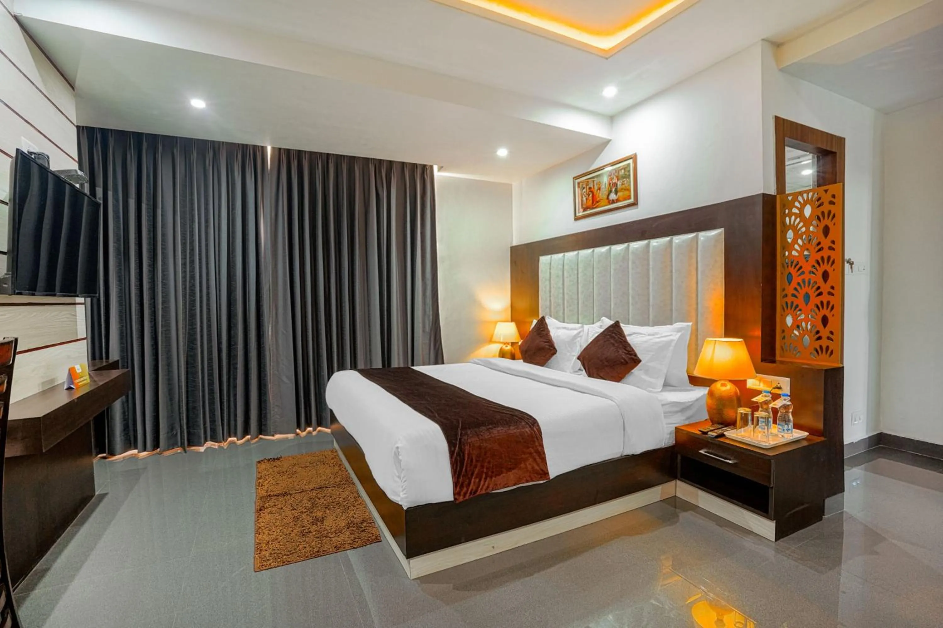 Bed in Aliza Inn And Suites By SRS Hotels