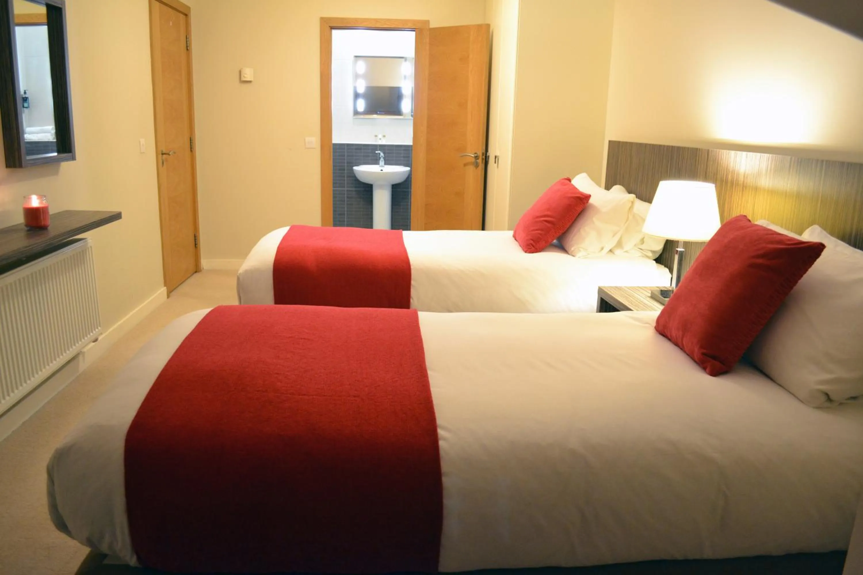 Bedroom, Bed in Carrick Plaza Suites and Apartments