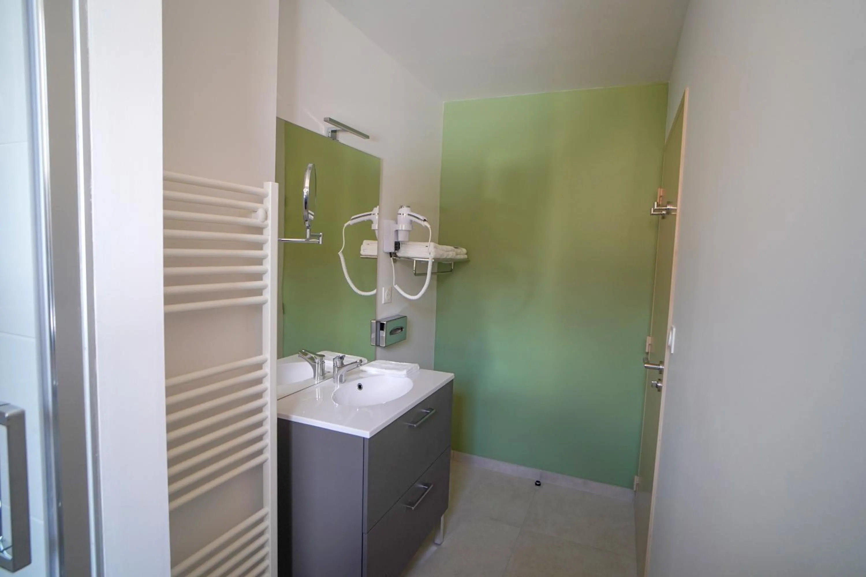 Bathroom in Hôtel de la Croix Blanche