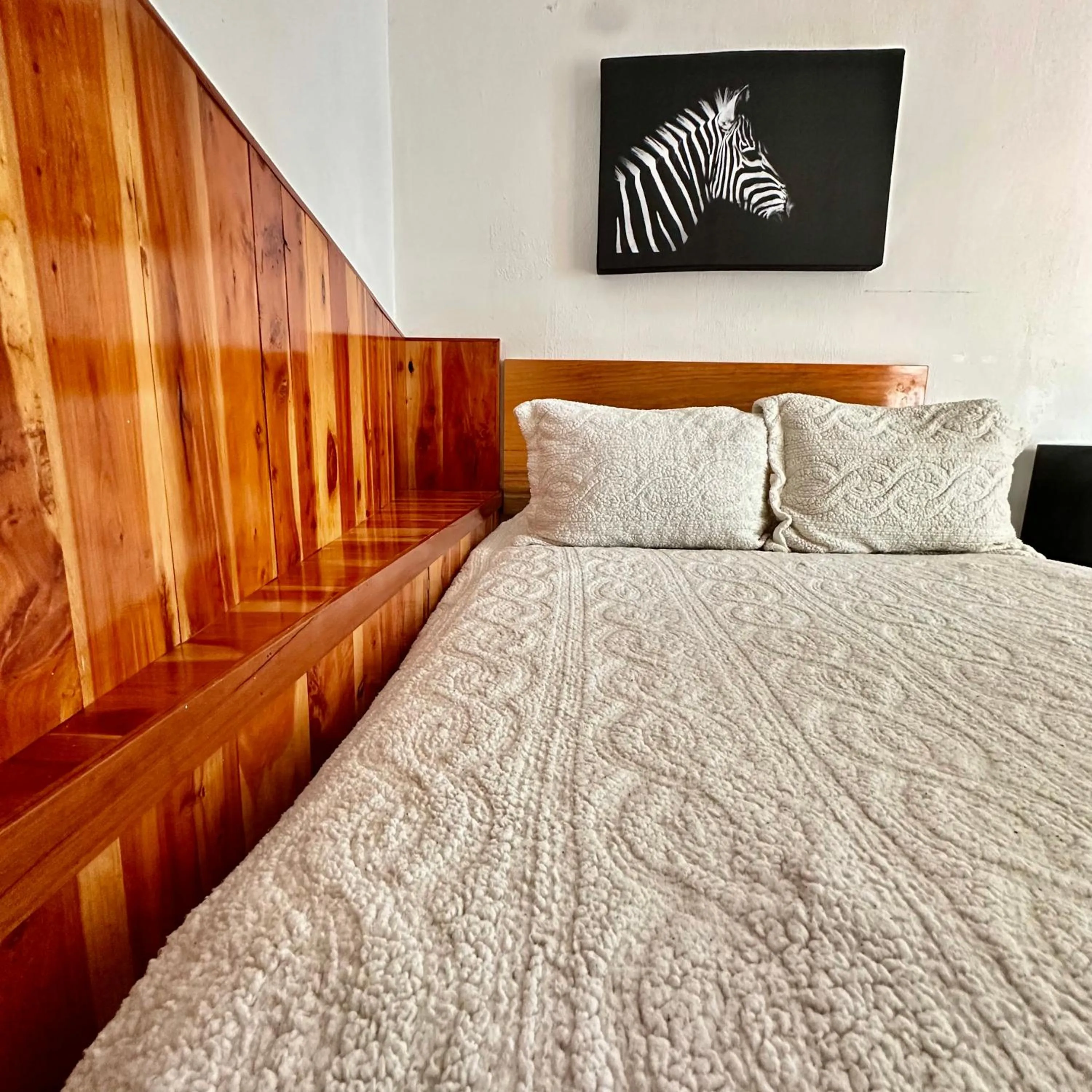 Bed in La Etelvina Suites