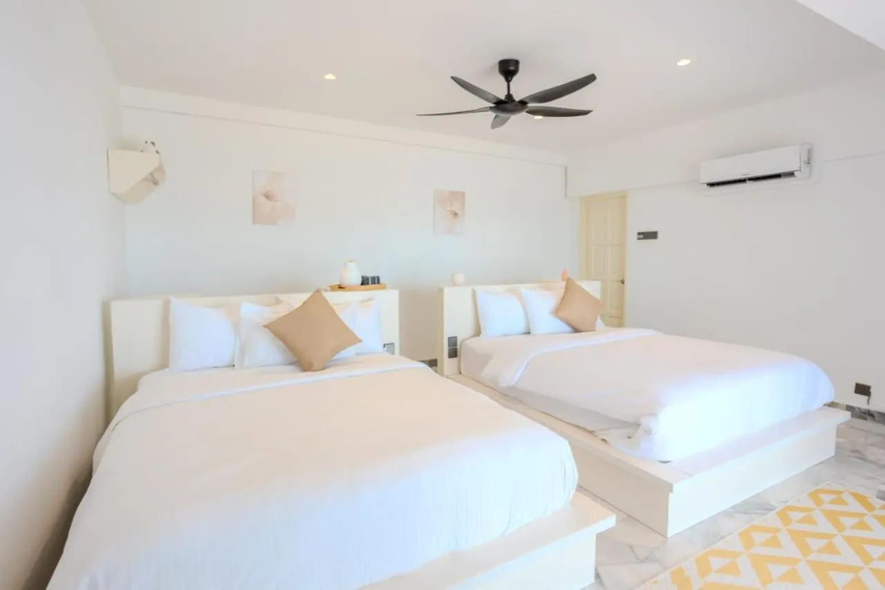Bed in Suntai Villa, Beachfront Suites