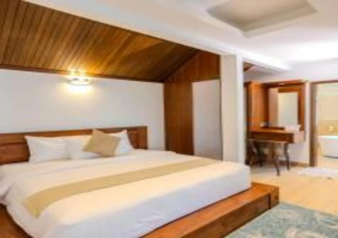 Bed in Suntai Villa, Beachfront Suites