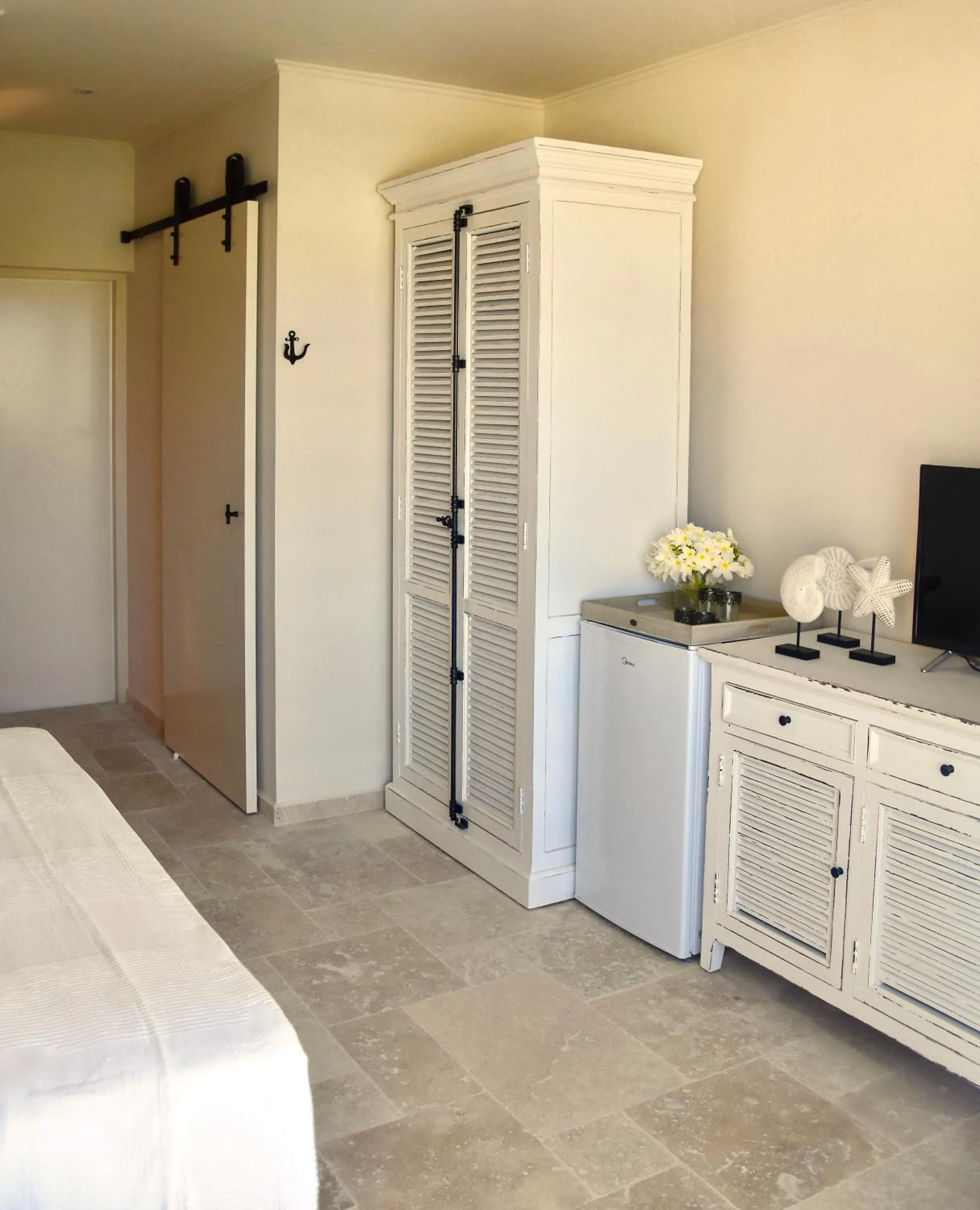 Toilet, Bed in Ocean Breeze Boutique Hotel & Marina