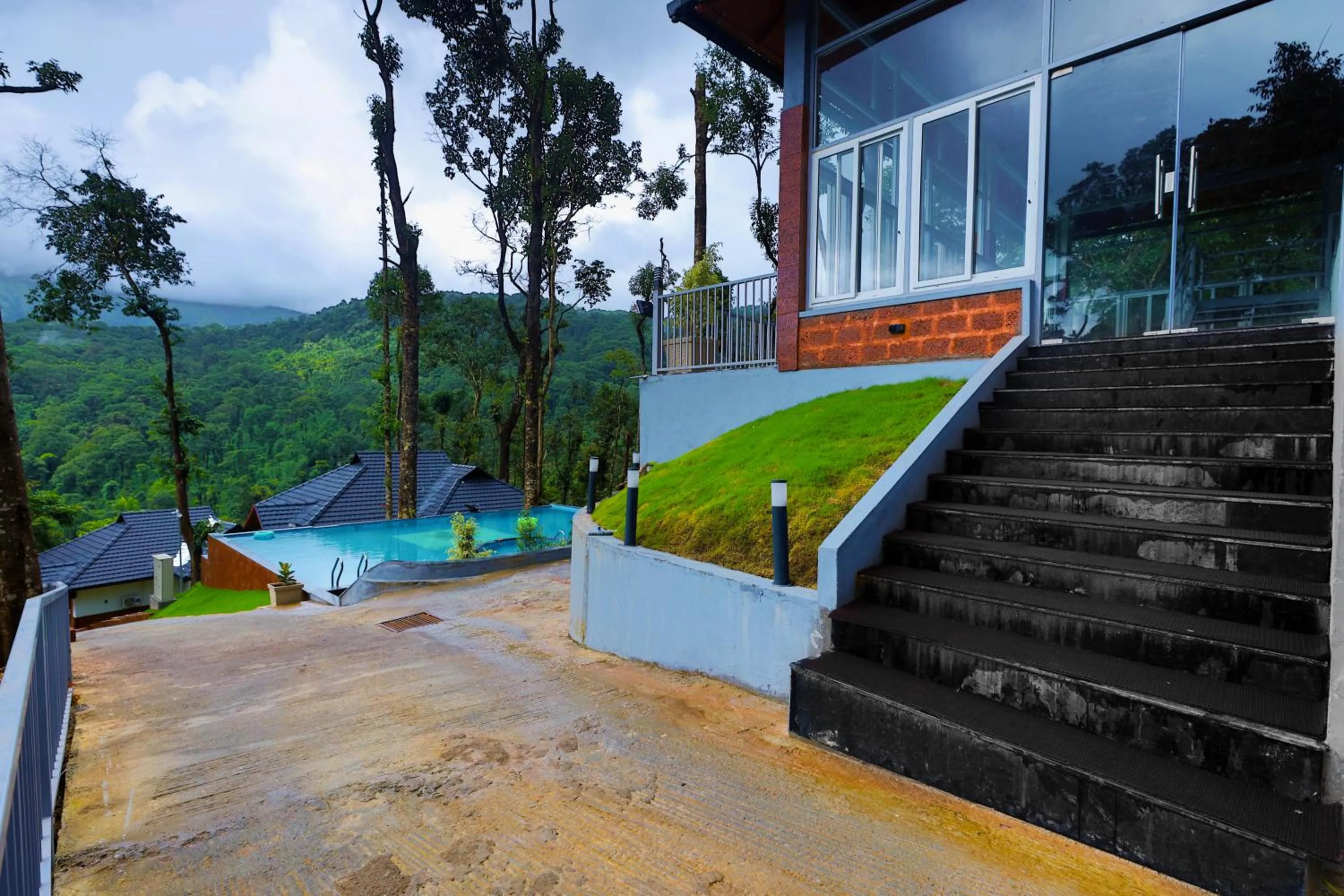 Swimming pool in Silent Brook Resort - Coorg