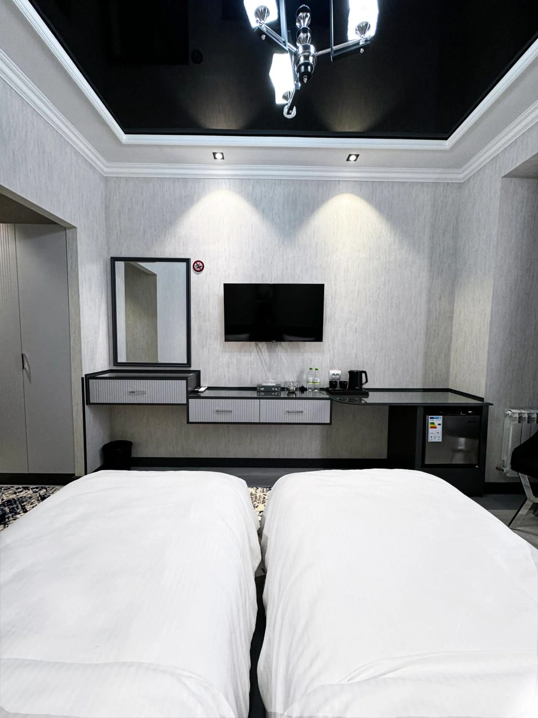 Bed in De Villa Hotel