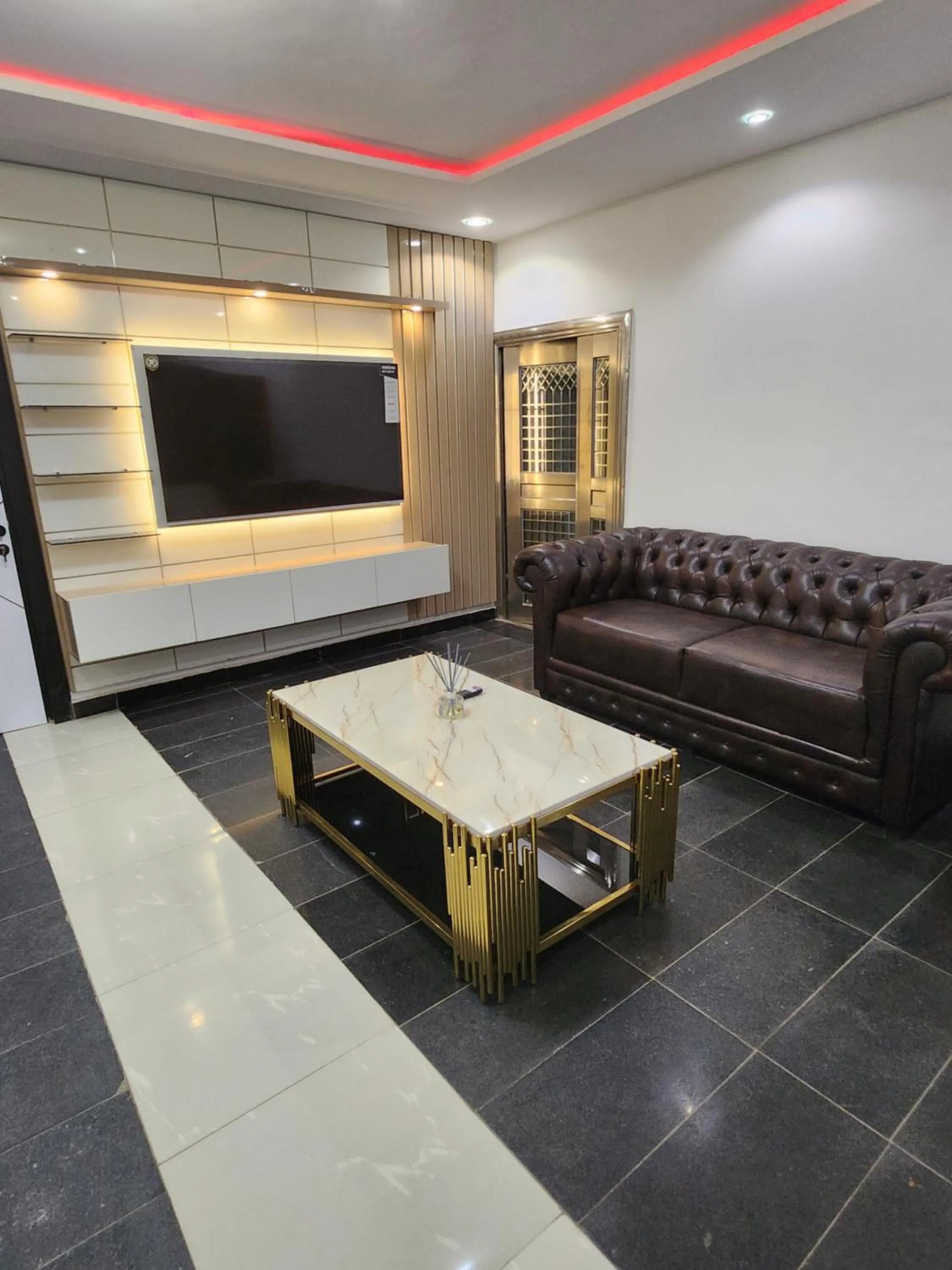Communal lounge/ TV room in Cozy Residence Abuja