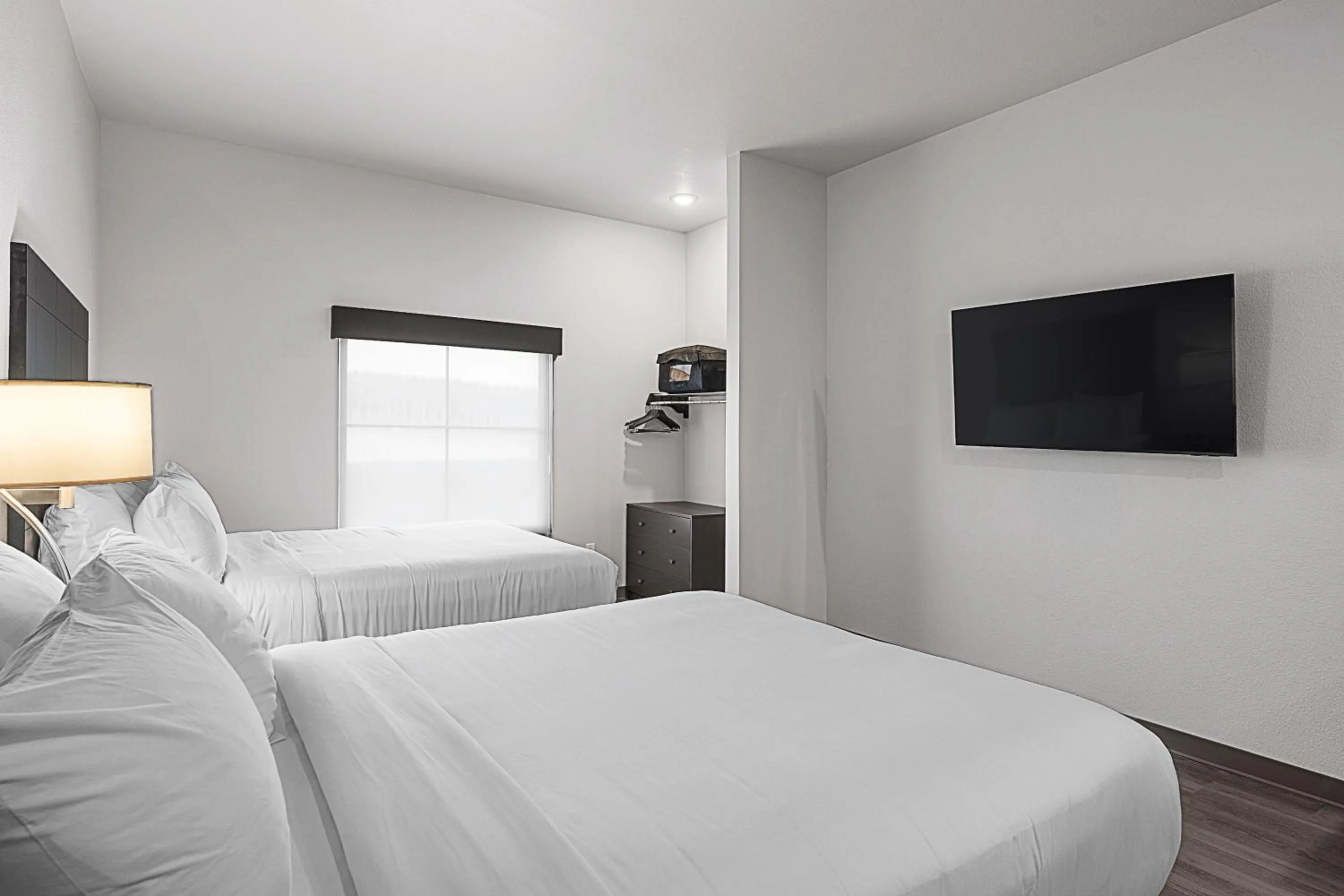 Bedroom, Bed in Riverstone Suites by Cobblestone Hotels - Chippewa Falls