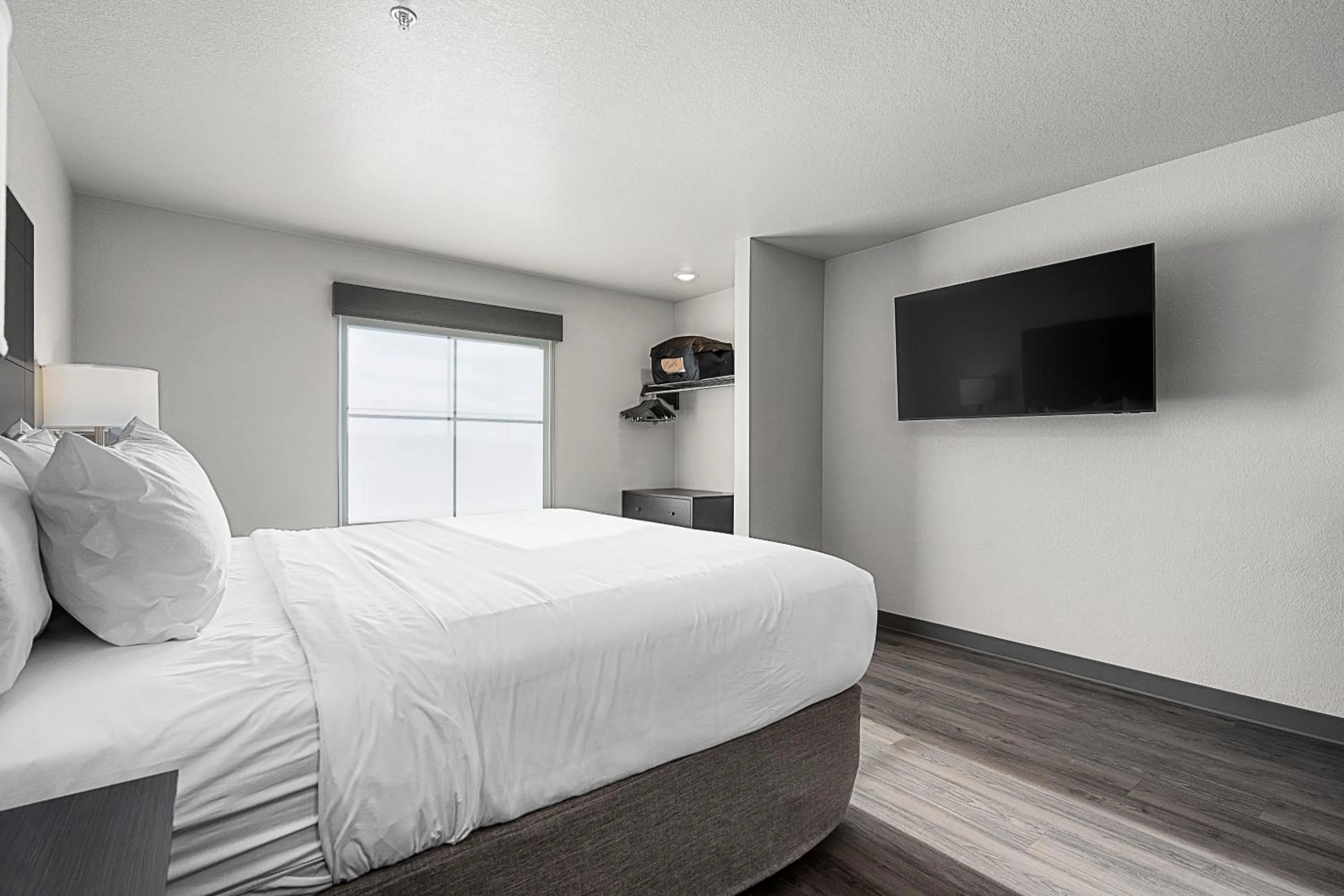 Bed in Riverstone Suites by Cobblestone Hotels - Chippewa Falls