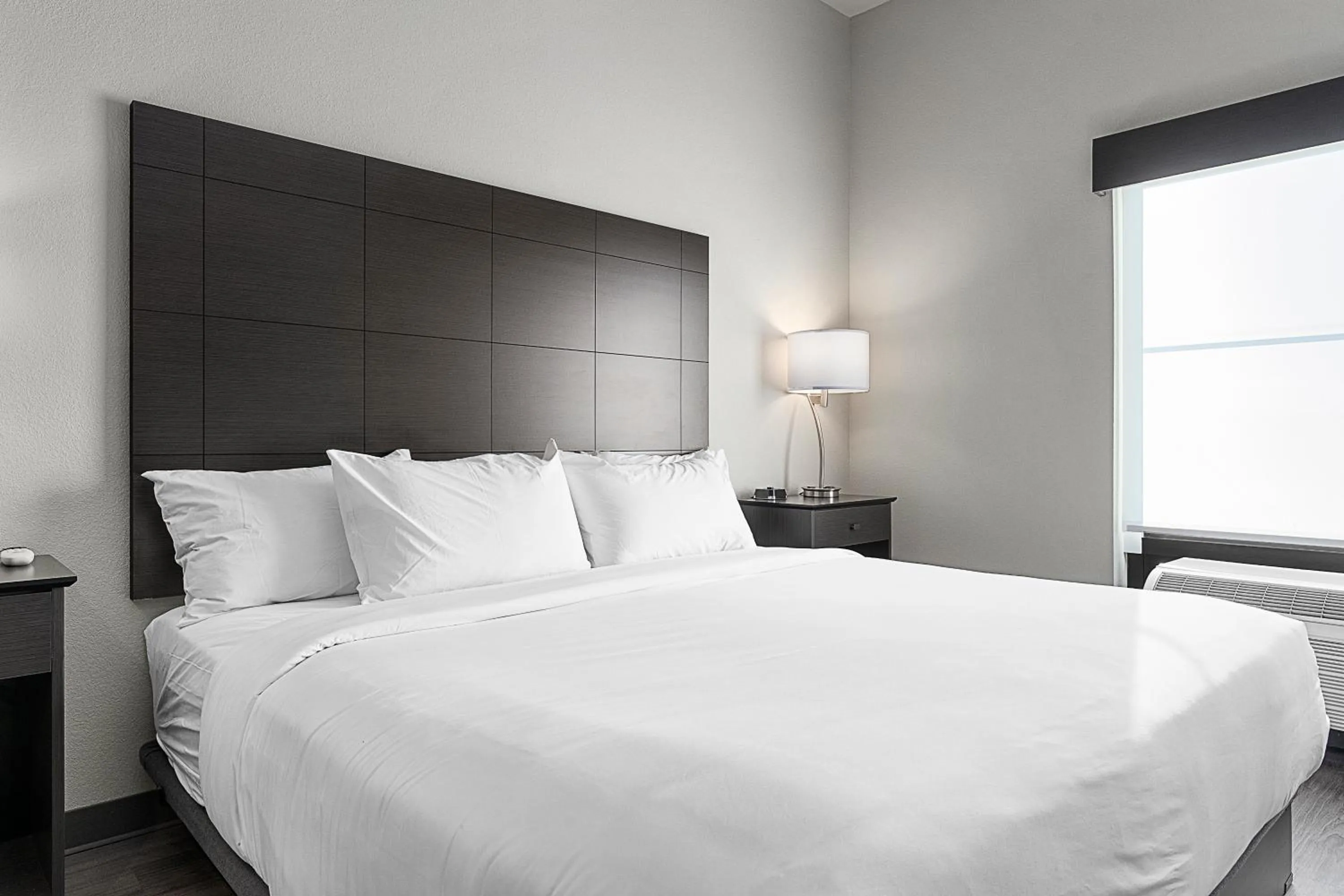 Bedroom, Bed in Riverstone Suites by Cobblestone Hotels - Chippewa Falls