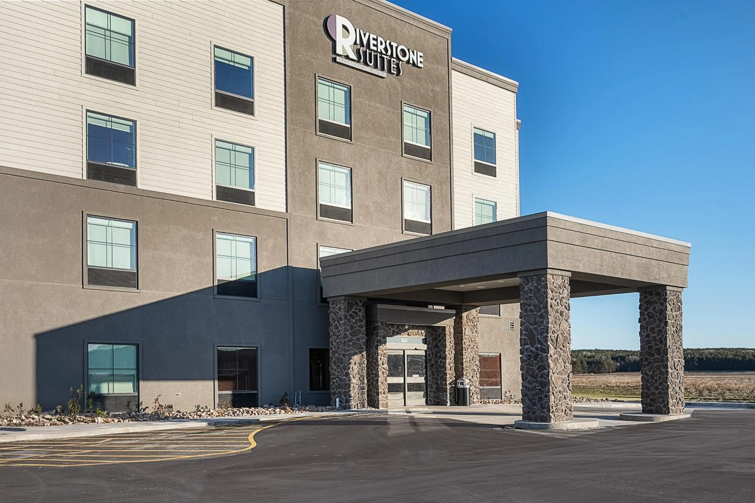 Property building in Riverstone Suites by Cobblestone Hotels - Chippewa Falls