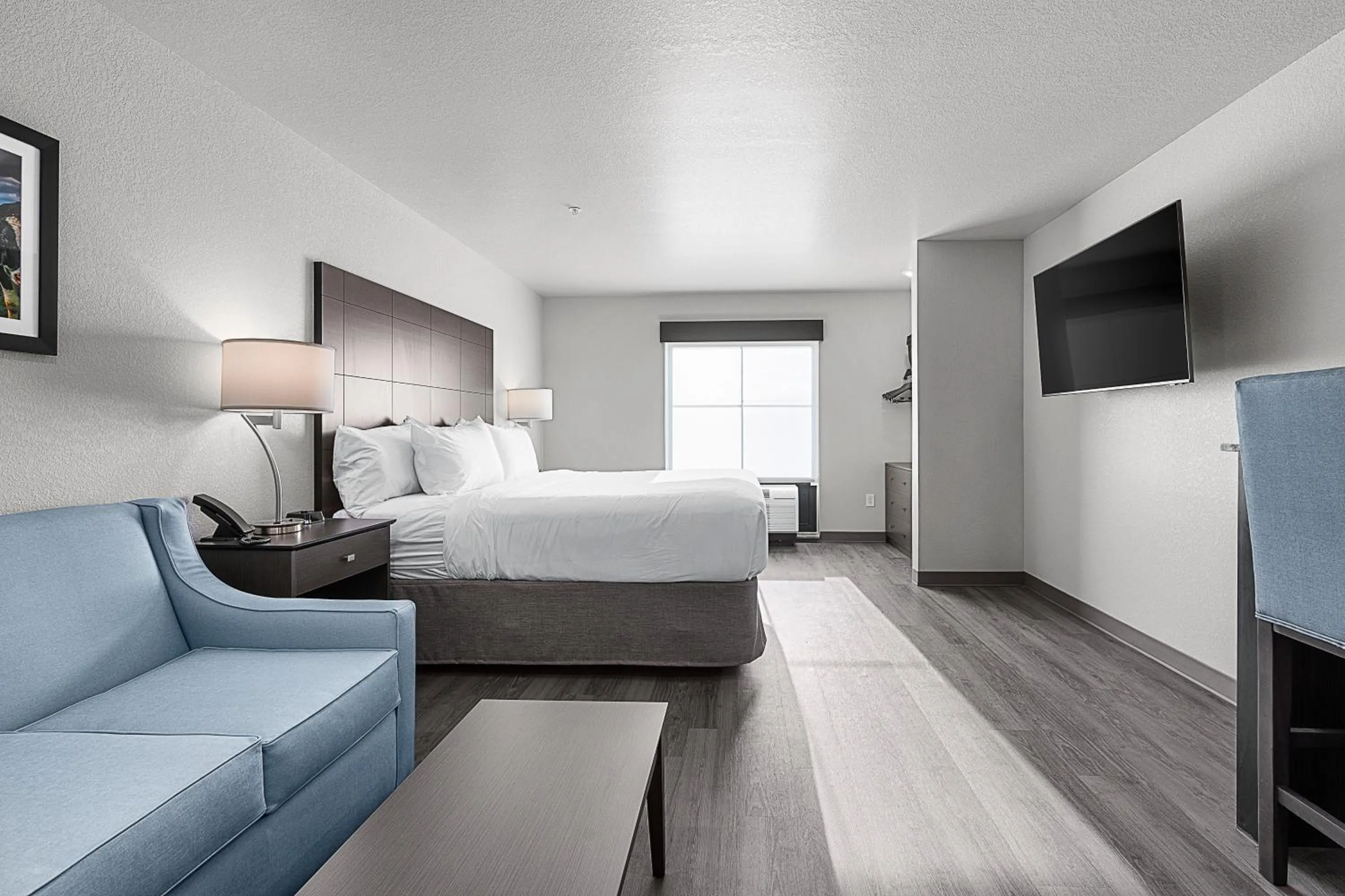 Bedroom, Bed in Riverstone Suites by Cobblestone Hotels - Chippewa Falls