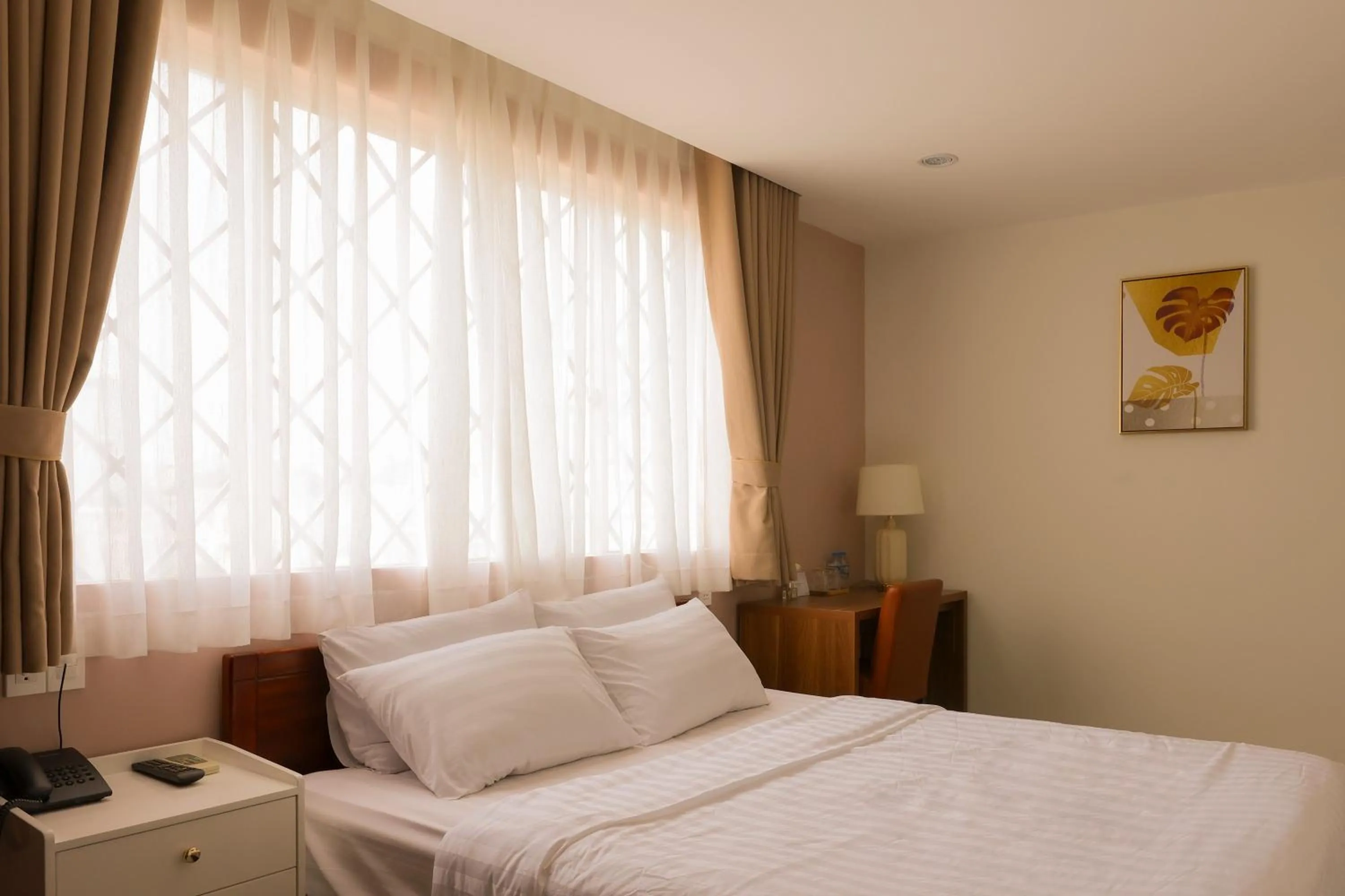 Bed in Lanura Saigon Boutique Hotel