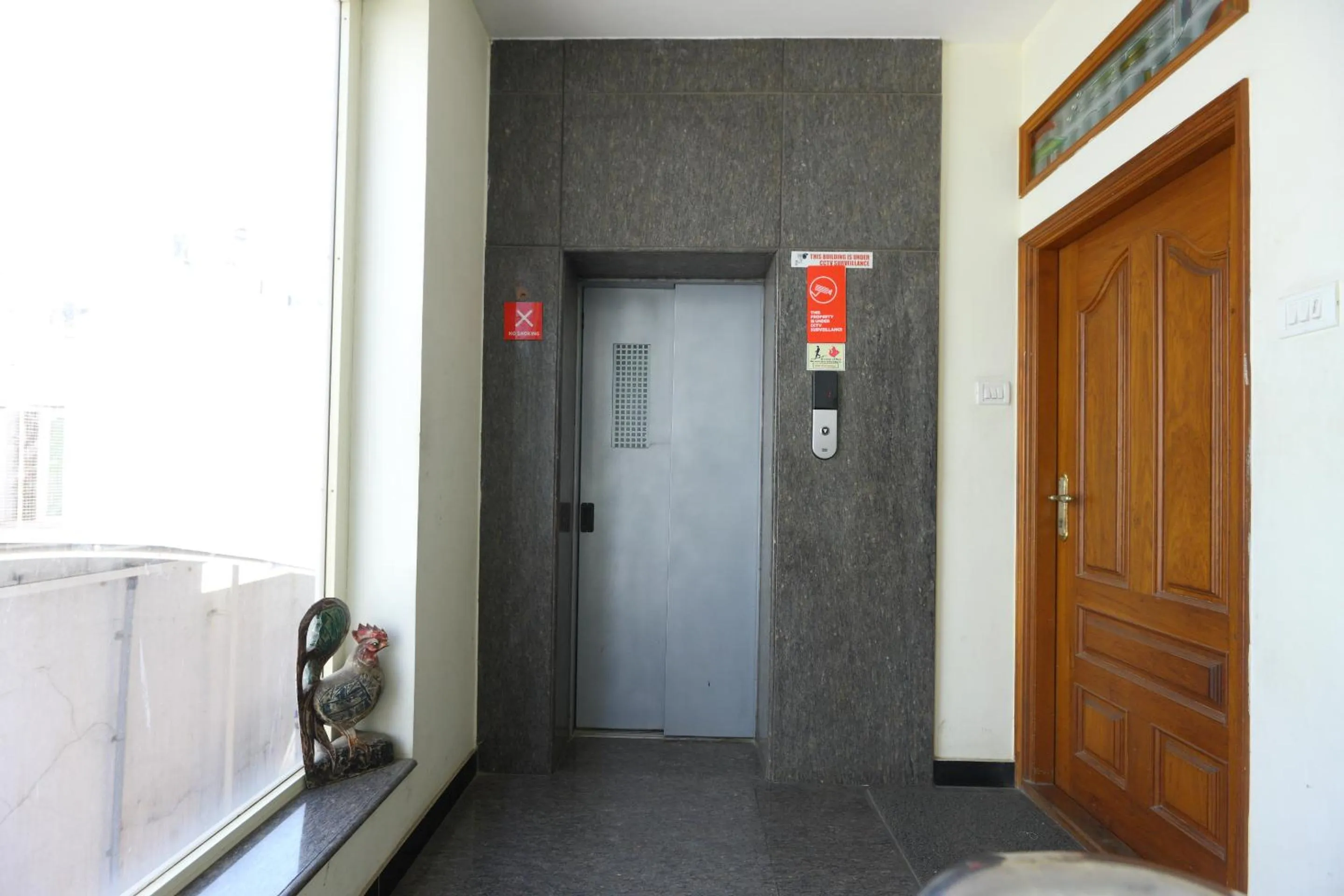 elevator in Super Hotel O Kings Court Near Rela Balaji Hospital
