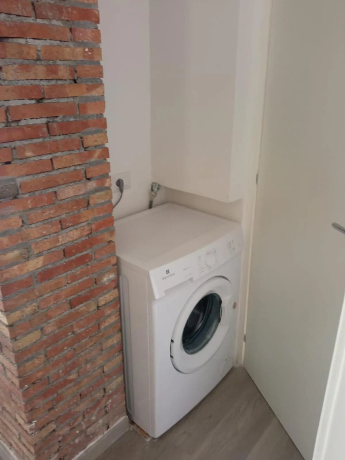 washing machine in ToviMar Apartments
