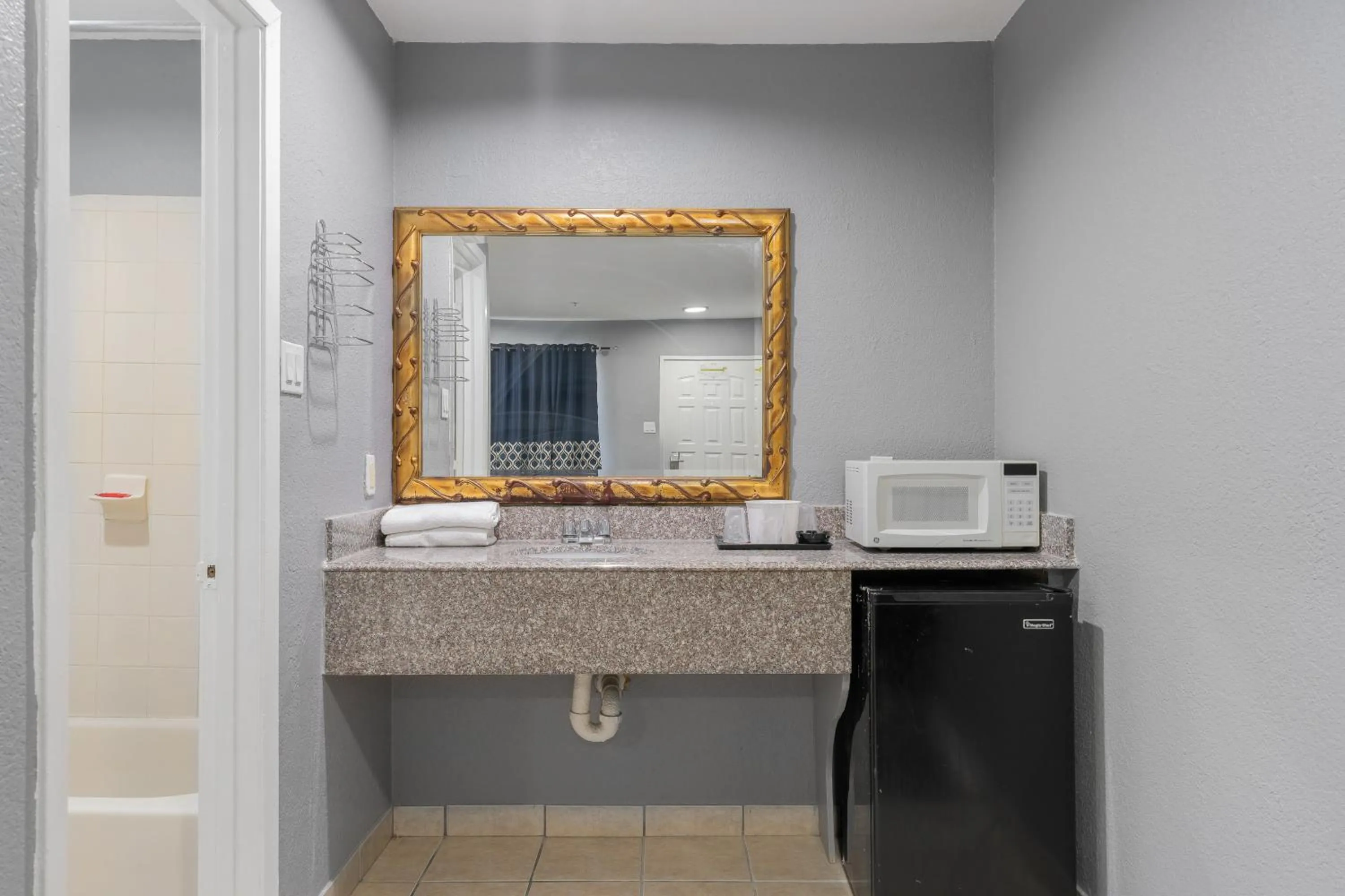 Bathroom in Golden Inn Dallas by Hotel O