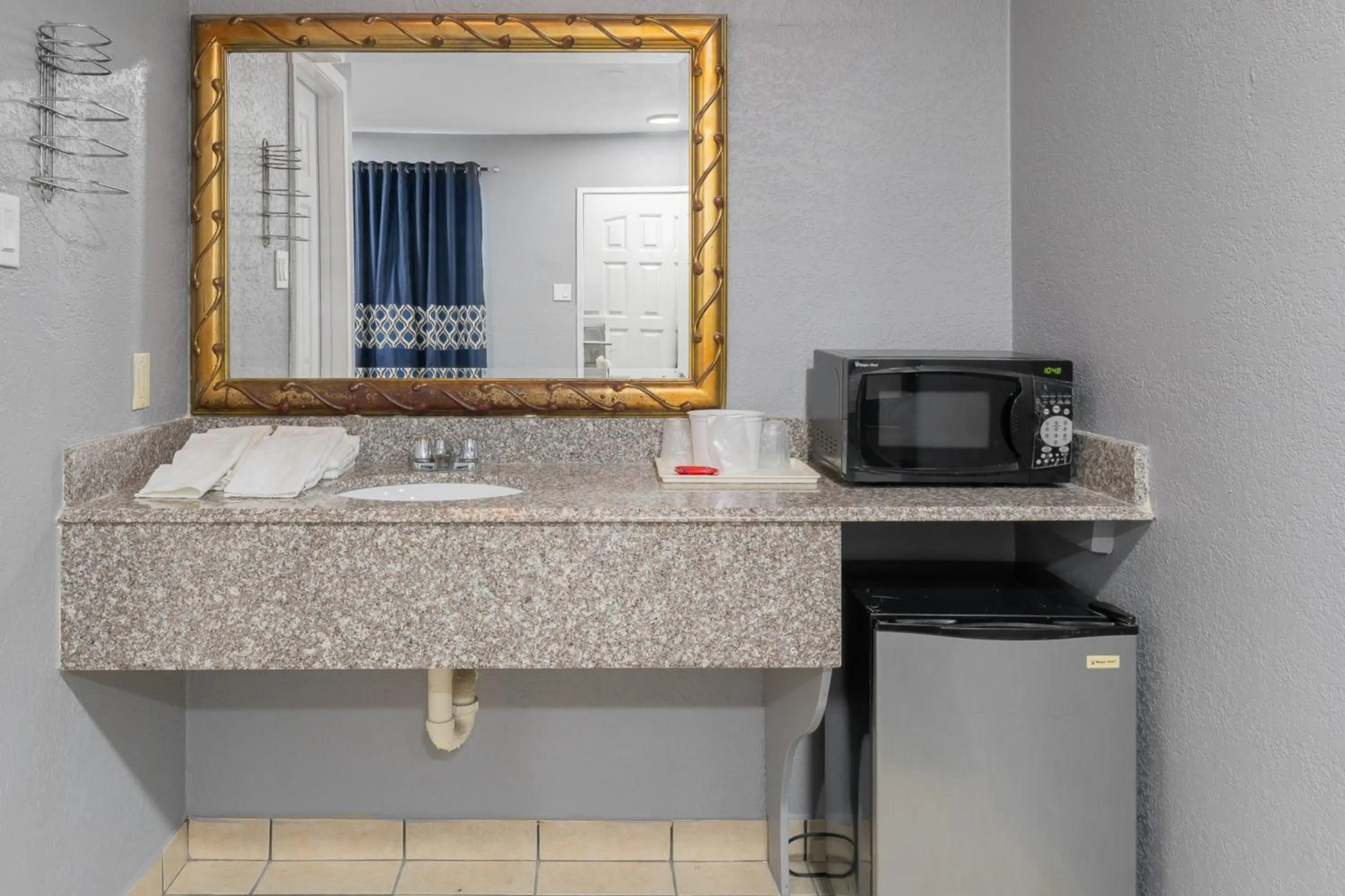 Bathroom in Golden Inn Dallas by Hotel O