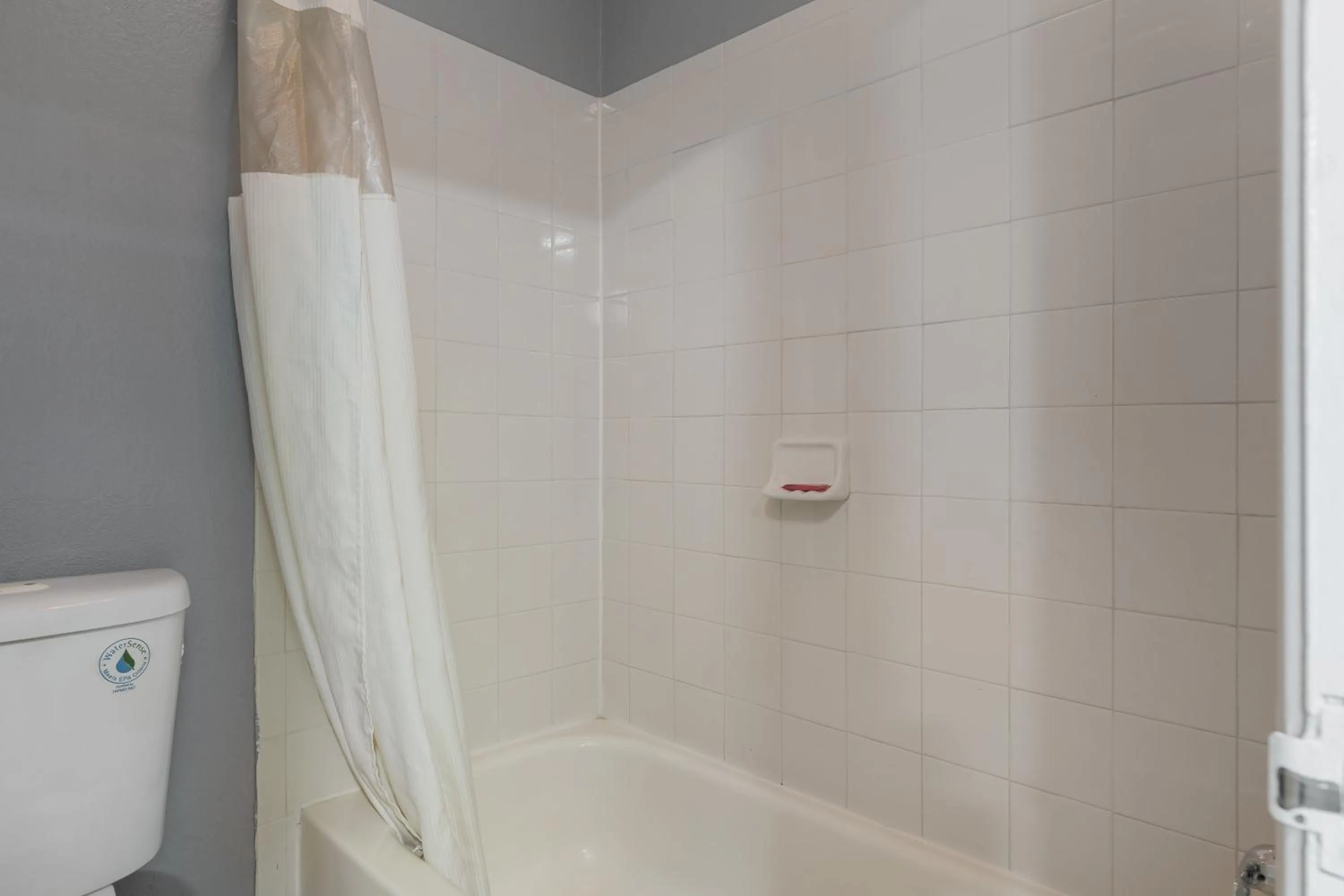 Shower in Golden Inn Dallas by Hotel O