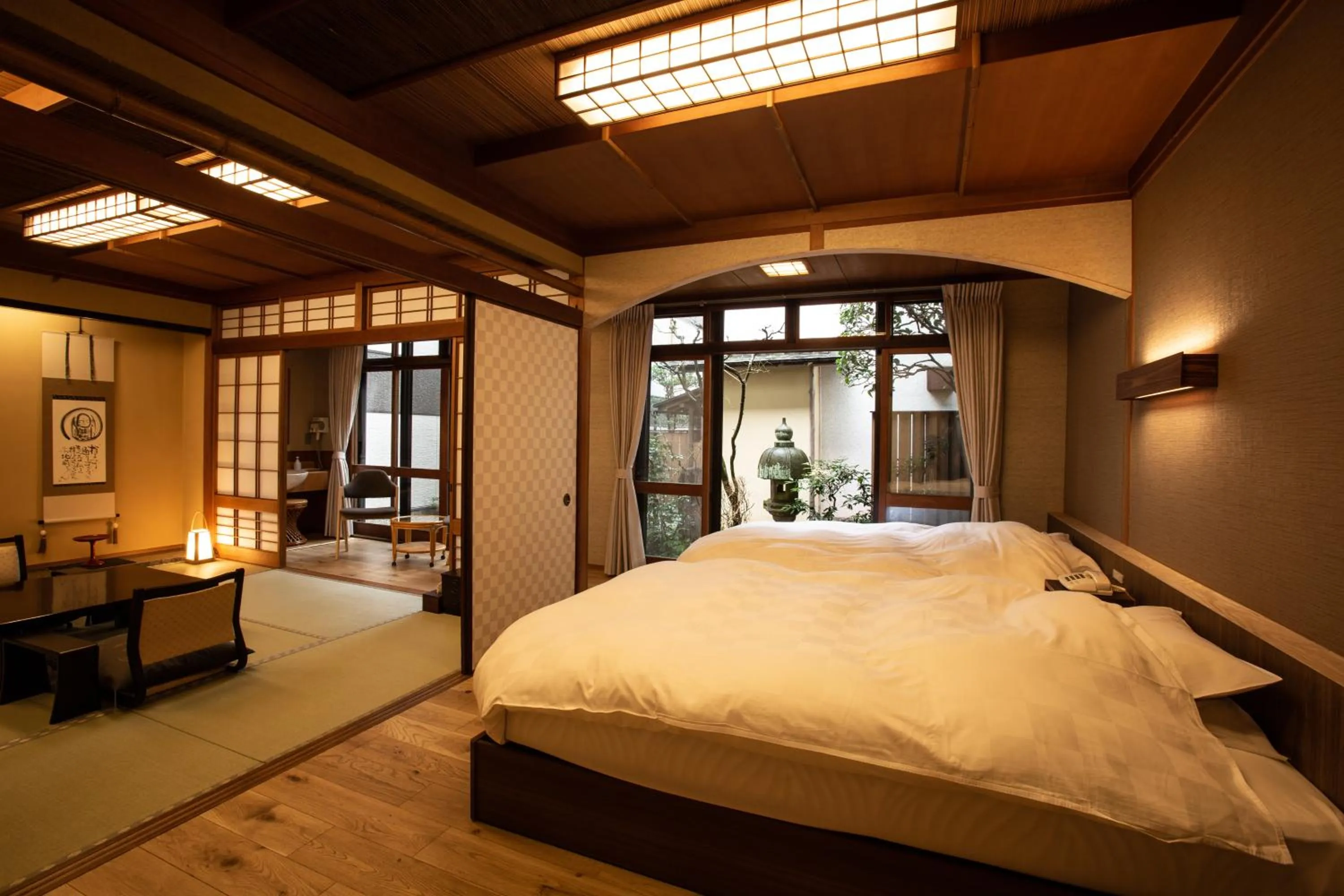 Bed in 城崎温泉 旅館 つばき乃 - Kinosaki Onsen Ryokan Tsubakino