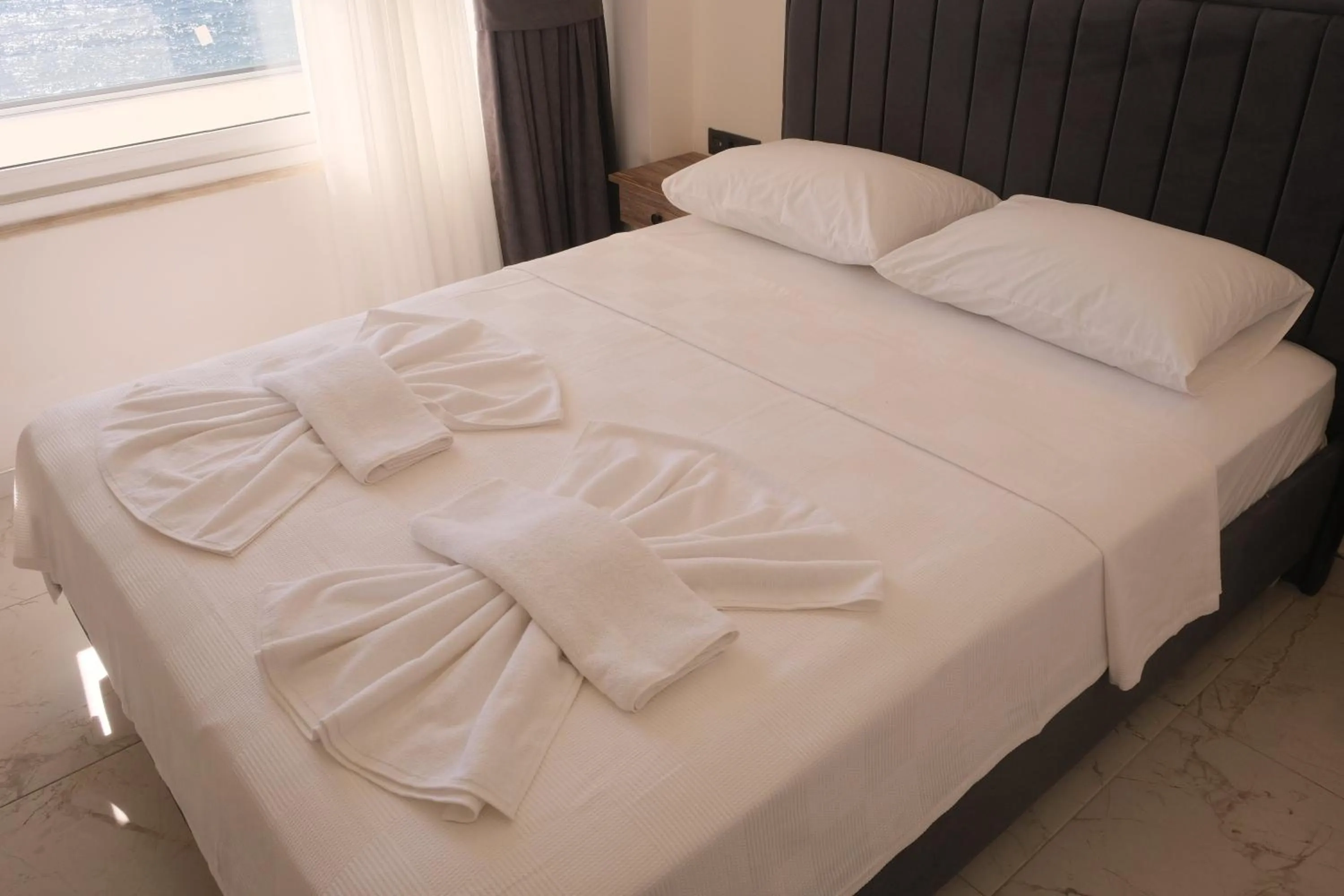 Bed in Sea Door Hotel