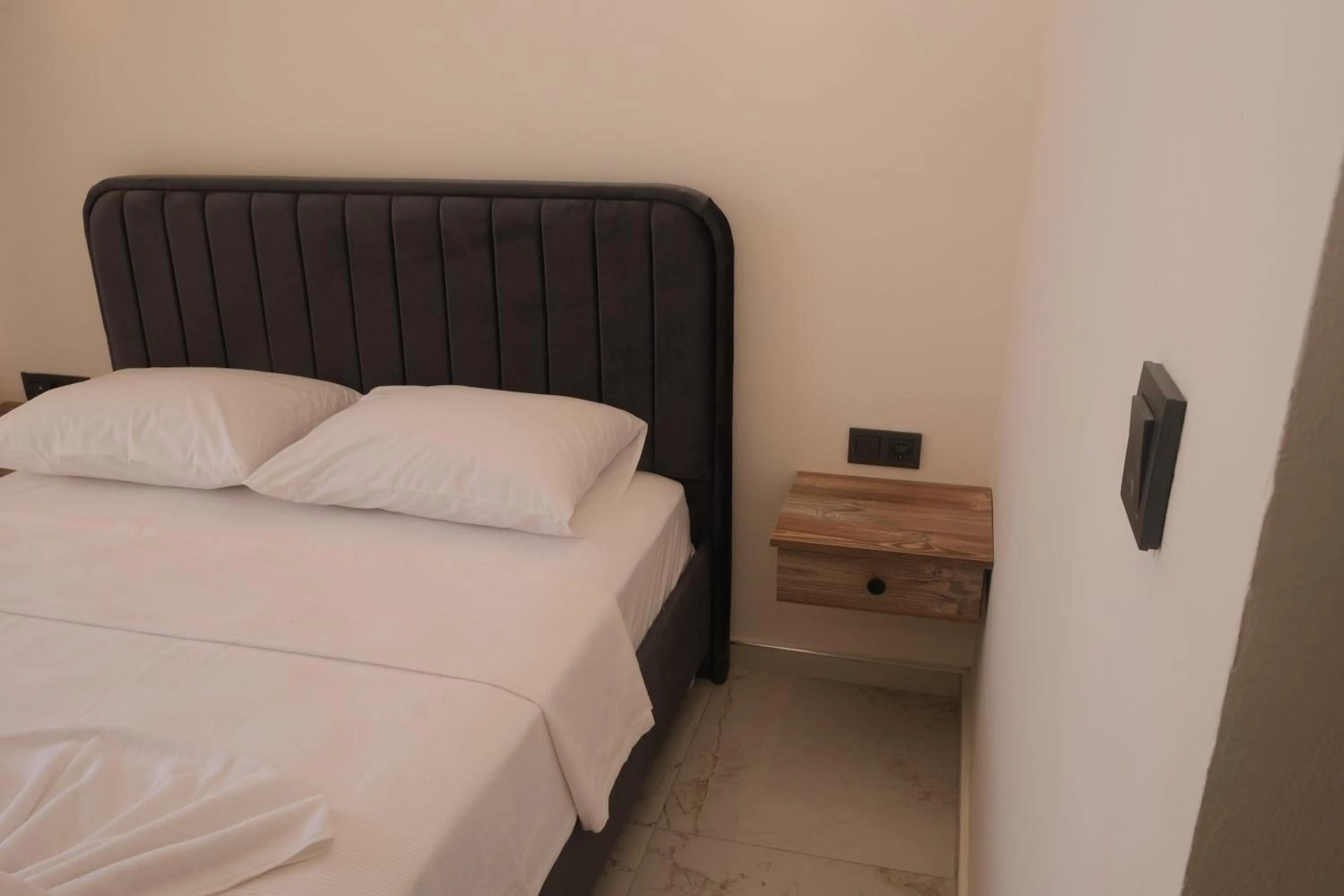 Bed in Sea Door Hotel