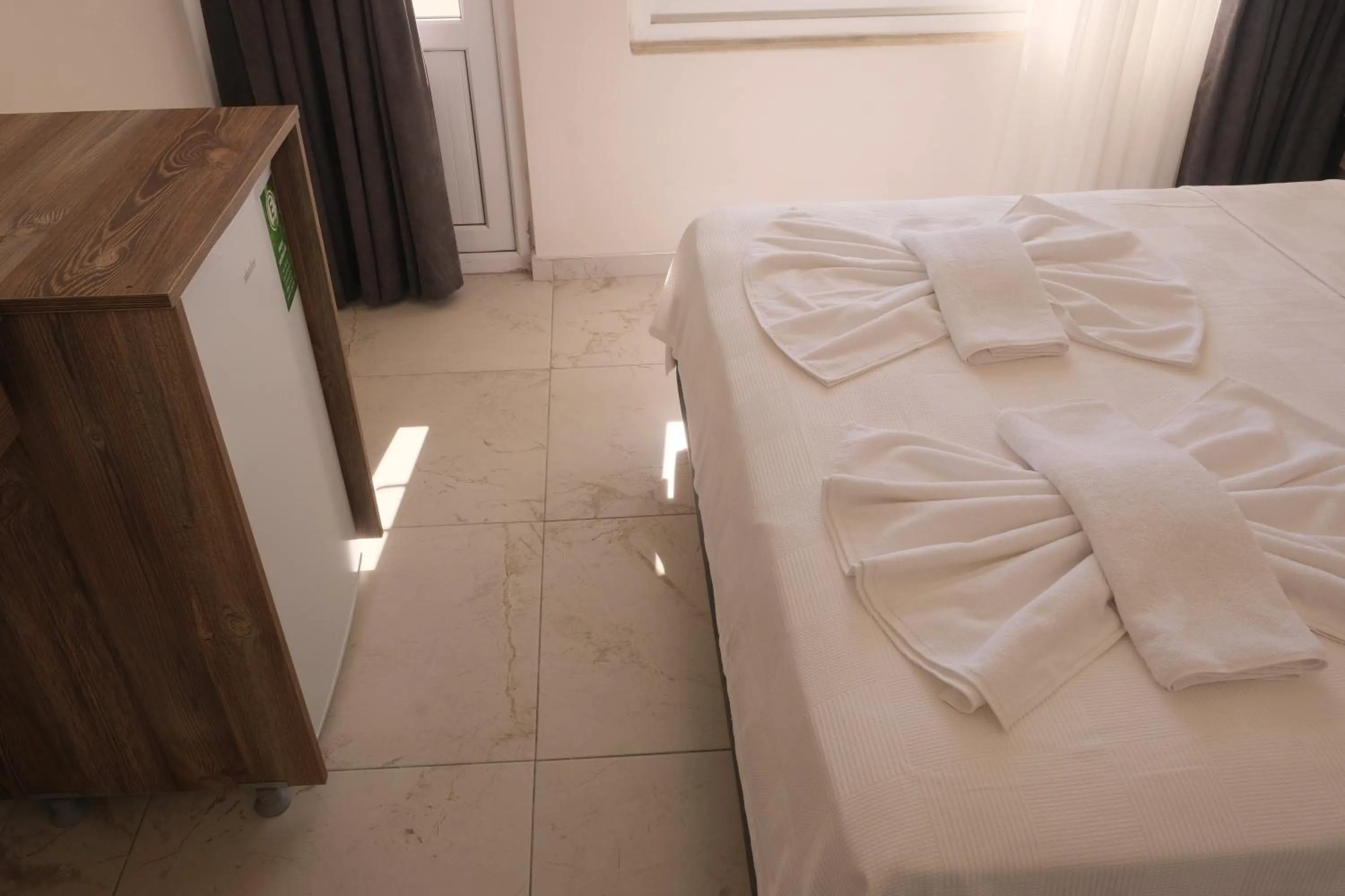 Bed in Sea Door Hotel