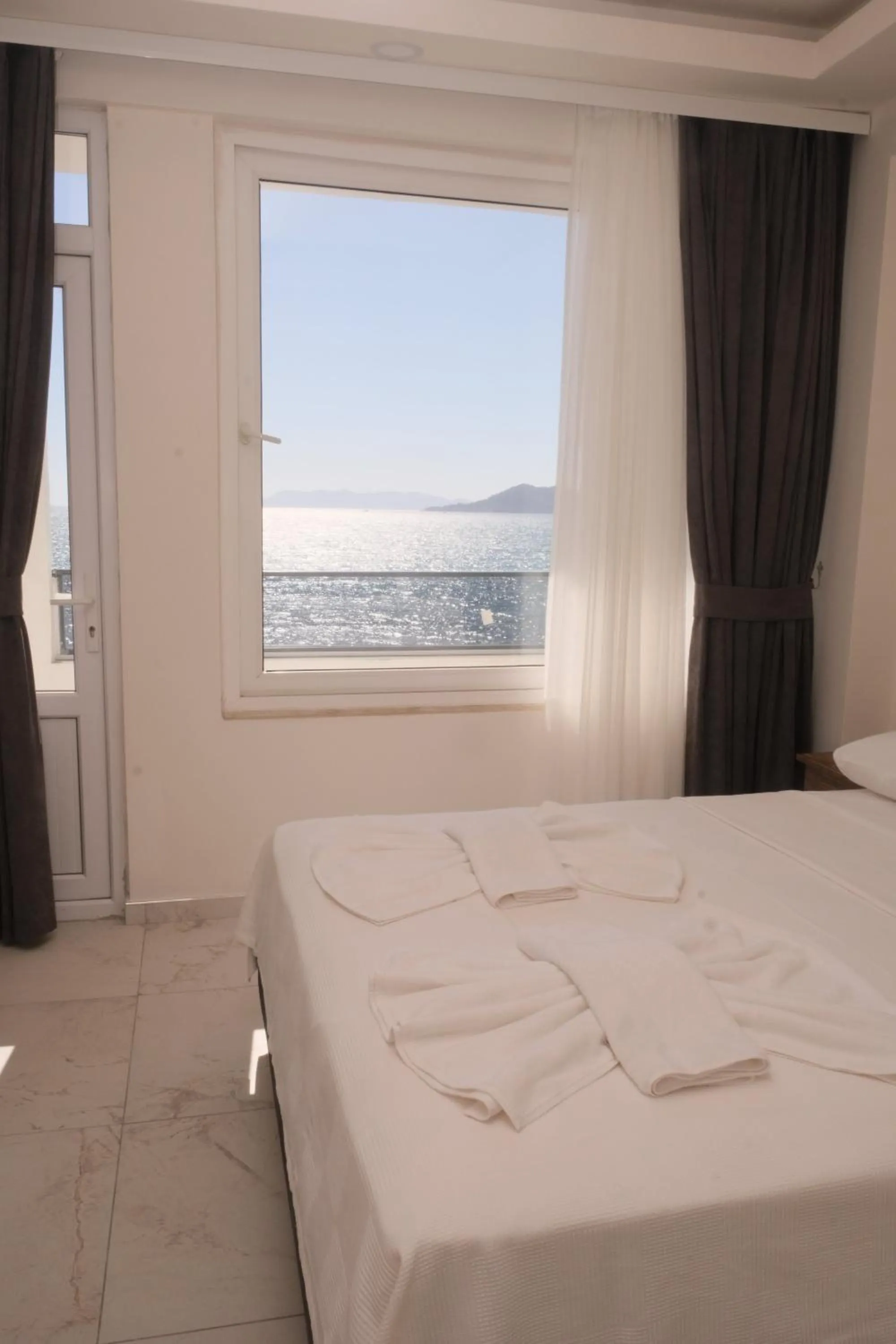 Bed in Sea Door Hotel
