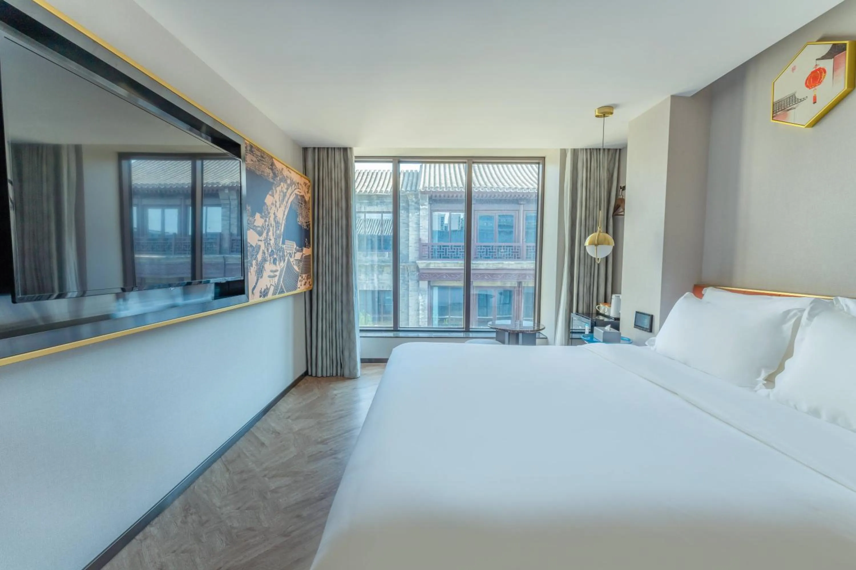 Bed in M Hotel - Beijing Tiananmen Square Qianmen Subway Station