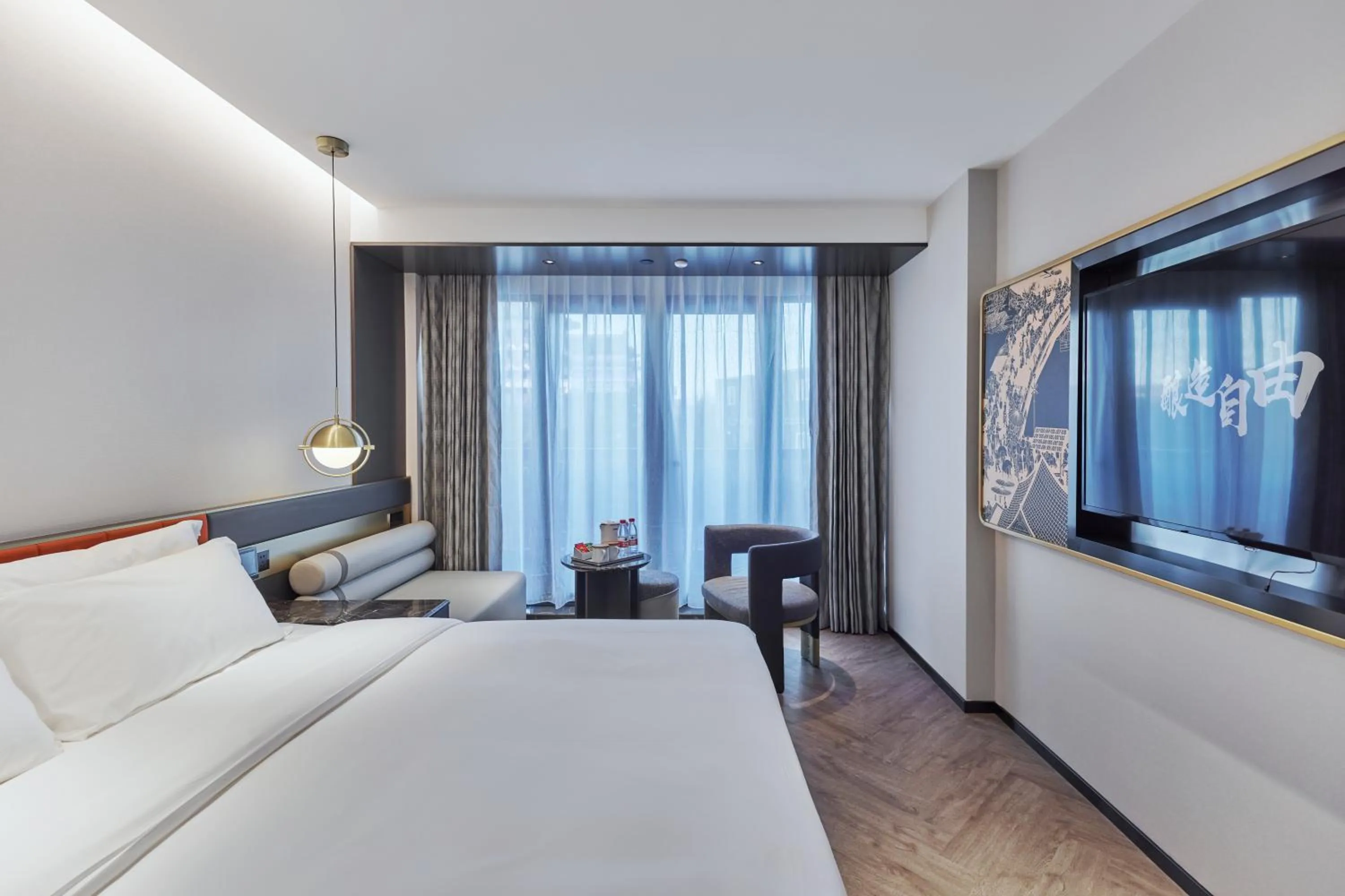 Bed in M Hotel - Beijing Tiananmen Square Qianmen Subway Station