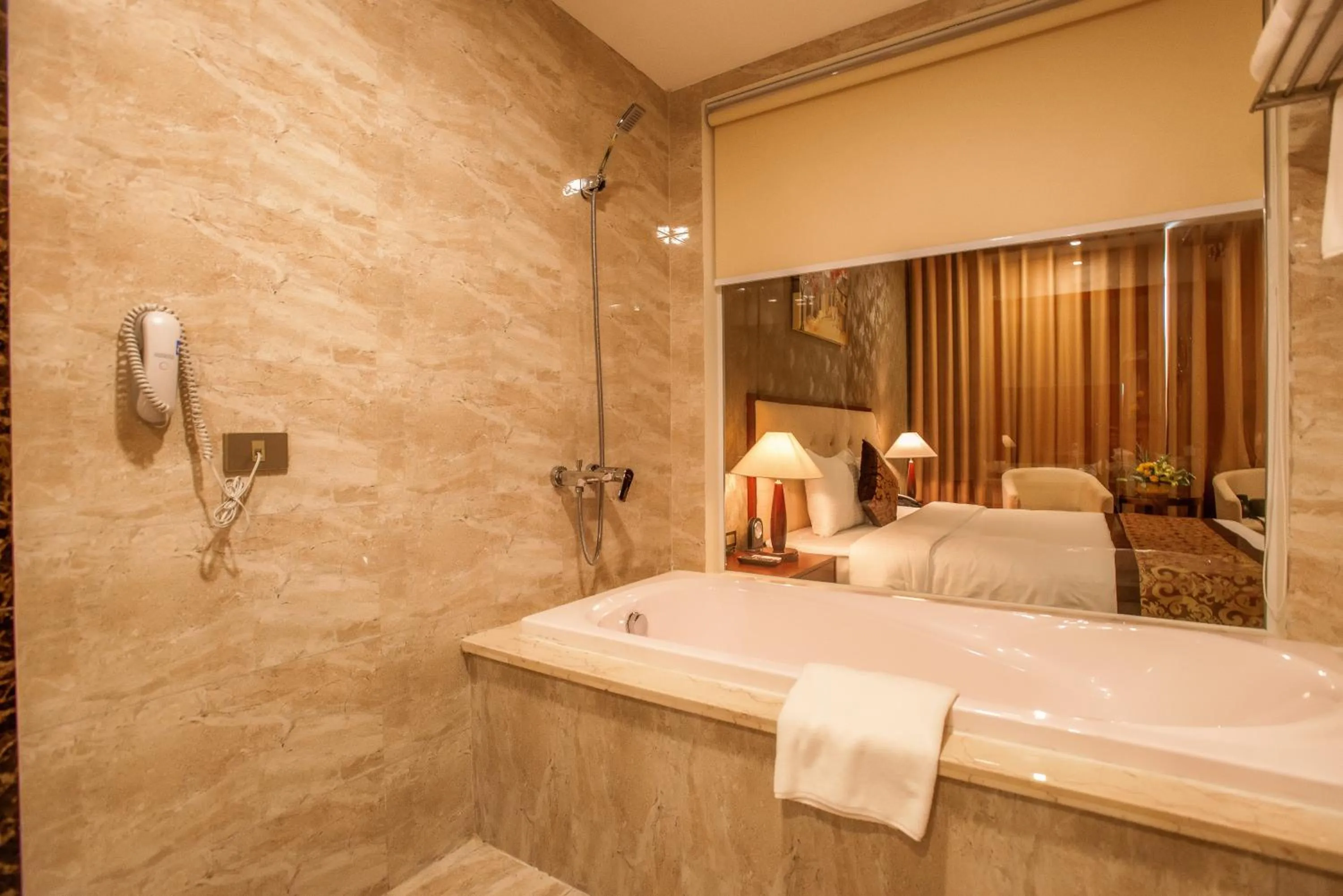 Shower, Bed in Muong Thanh Grand Bac Giang Hotel