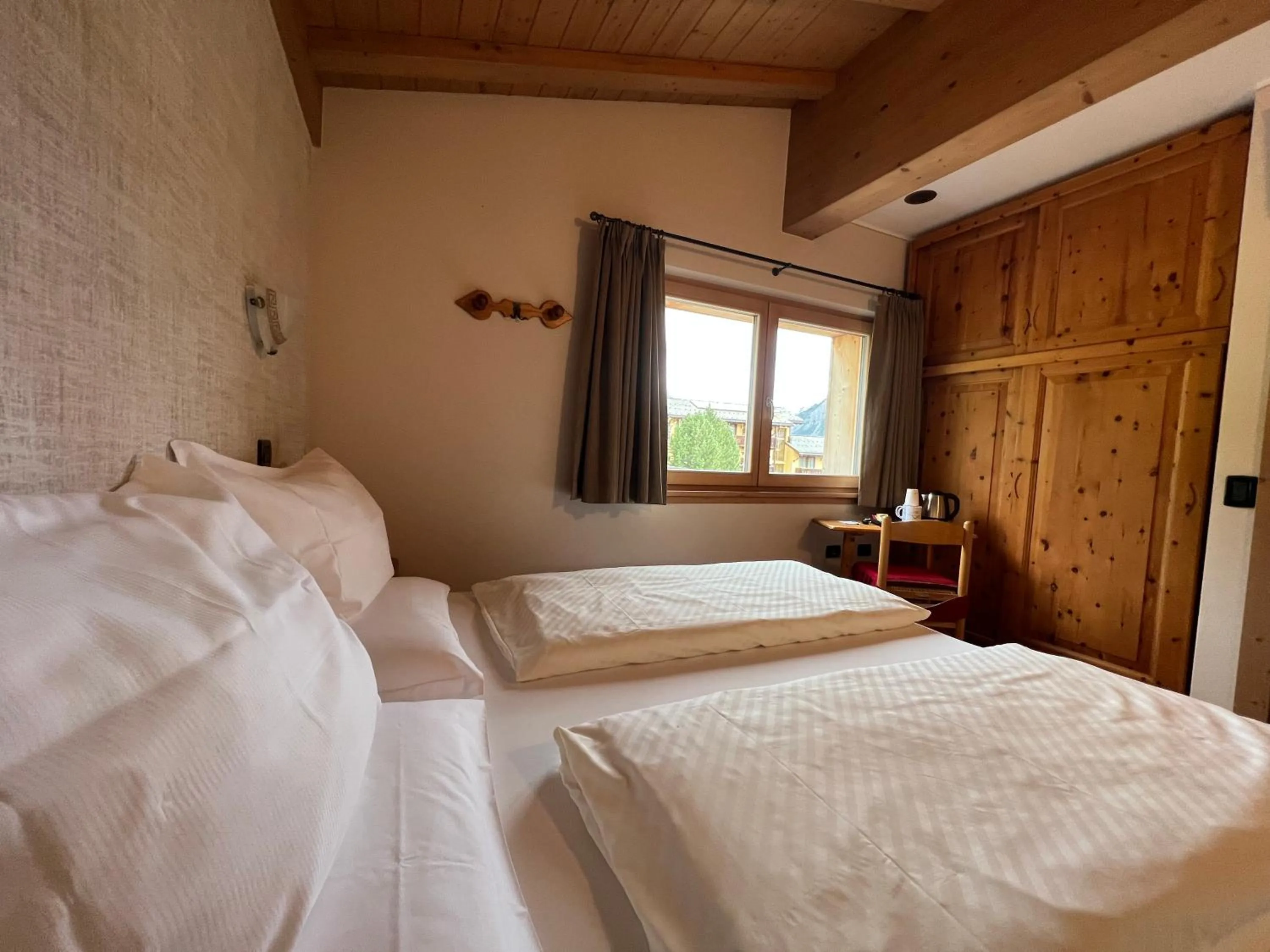 Bed in Hotel Le Alpi