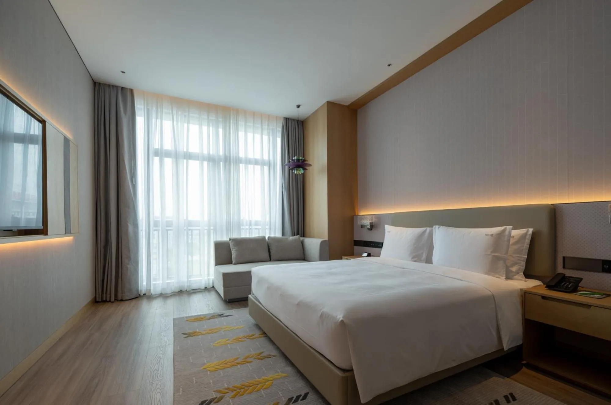 Photo of the whole room, Bed in Holiday Inn Guiyang Airport by IHG