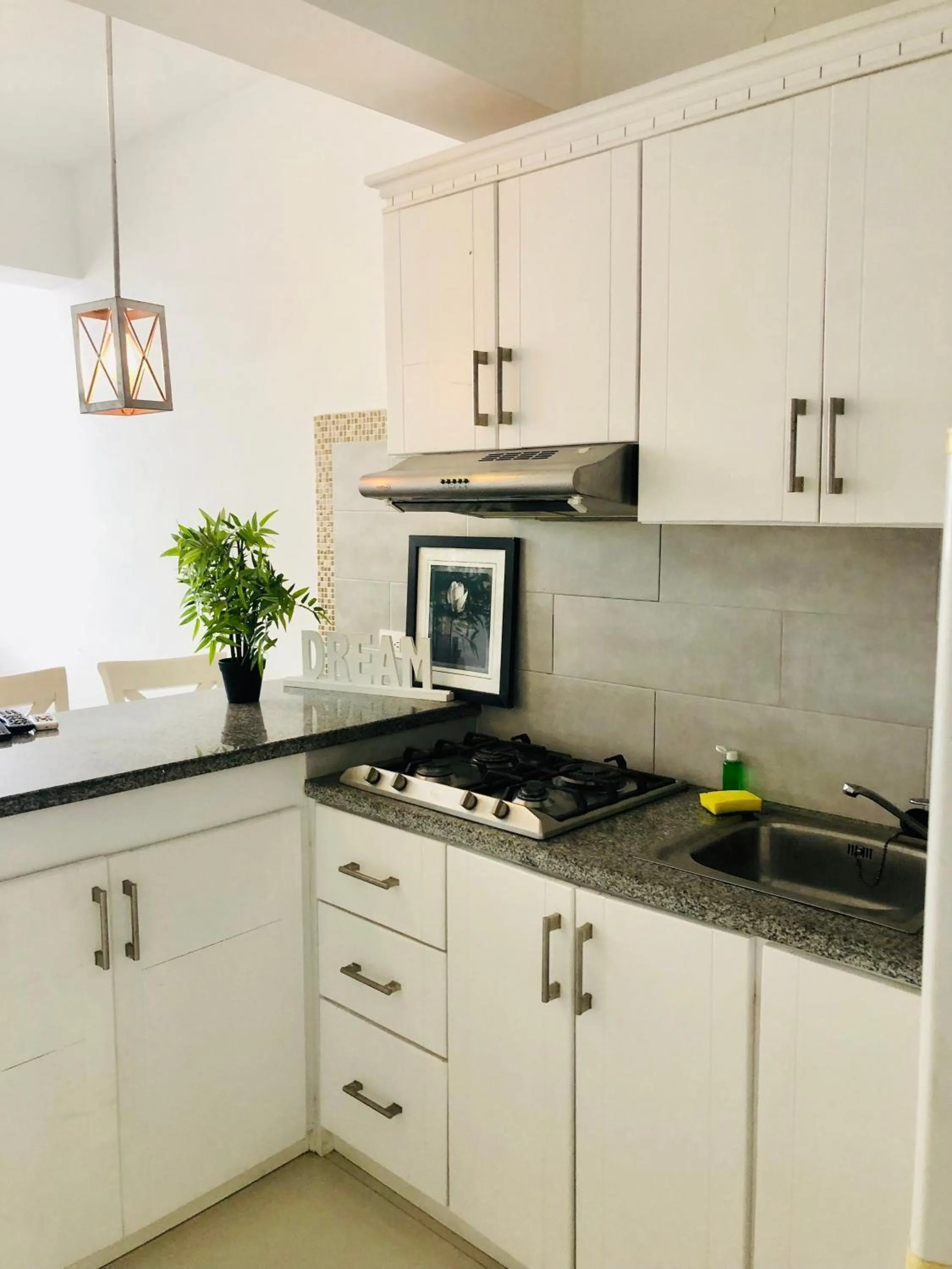 Kitchen/Kitchenette in Ducassi Rooftop Pool Suites Beach Club and SPA