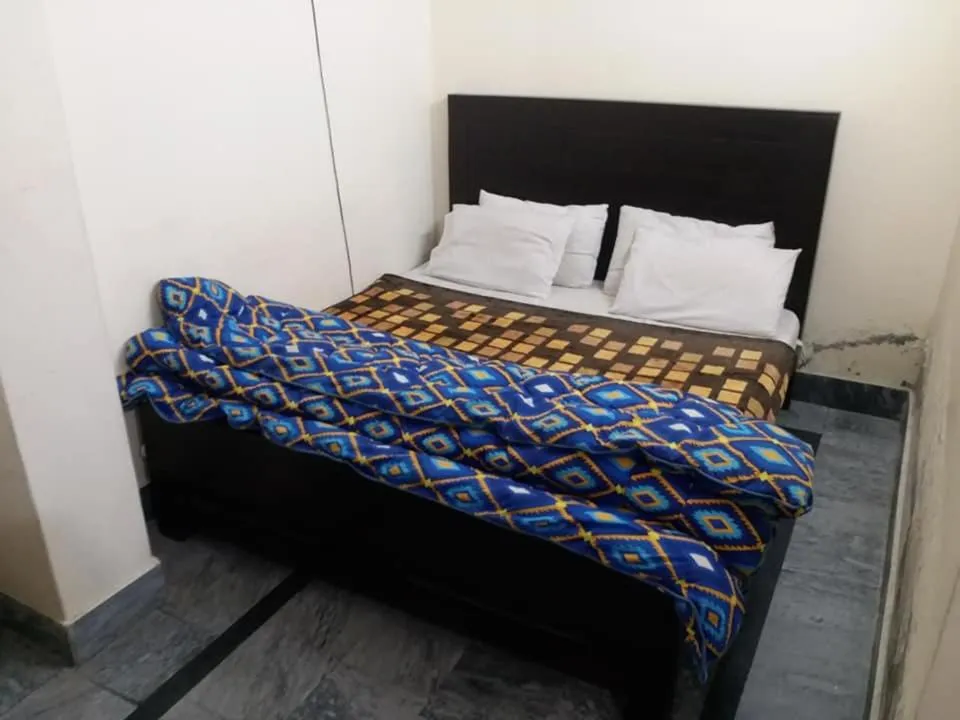 Bed in Kashmir Inn Hotel