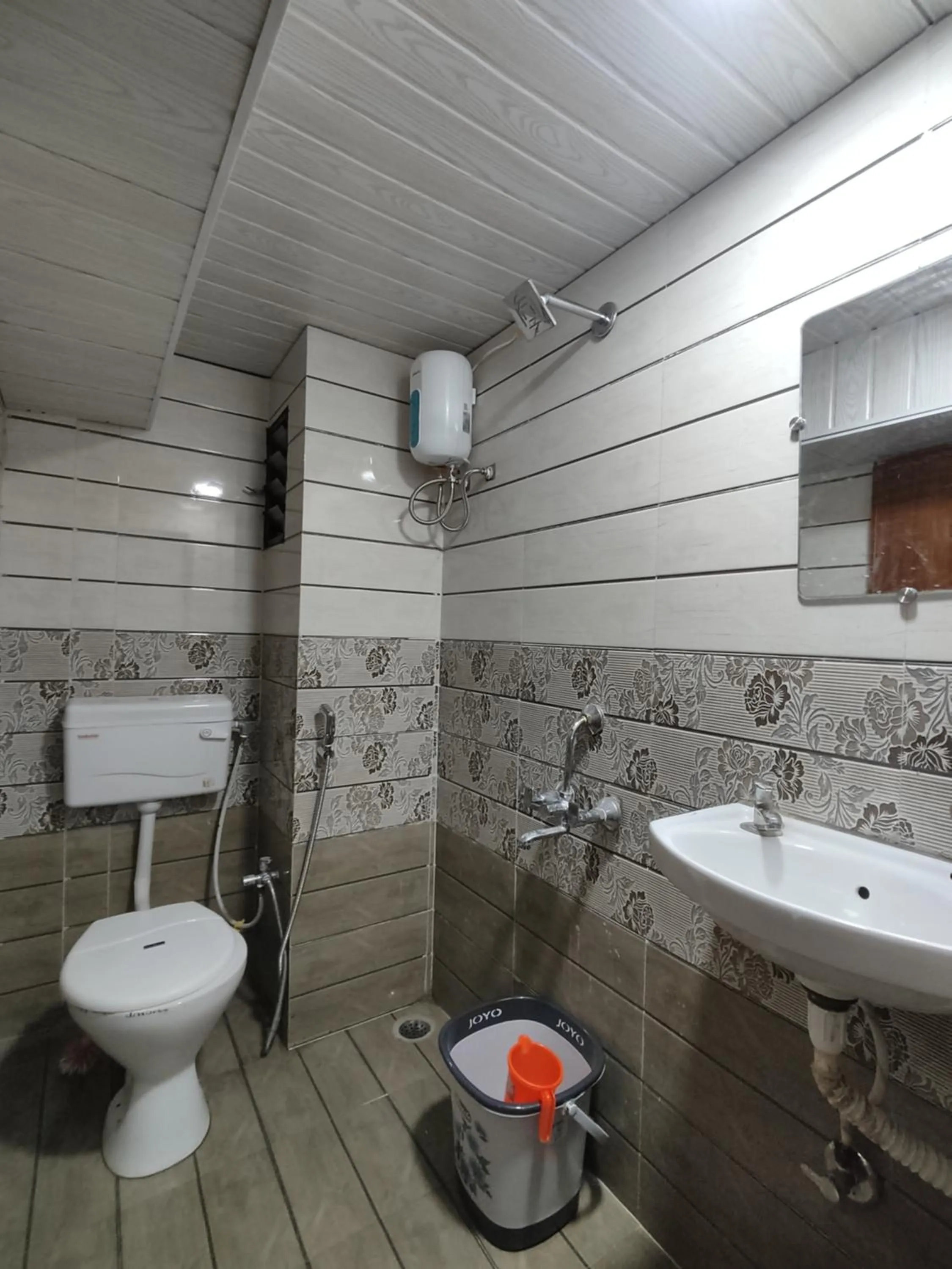 Bathroom in Ambient Homestay by NESTEASY