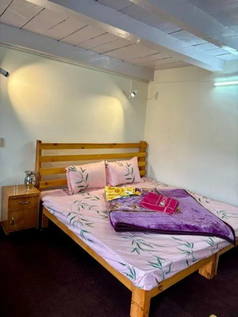 Bed in HOTEL NIRVANA