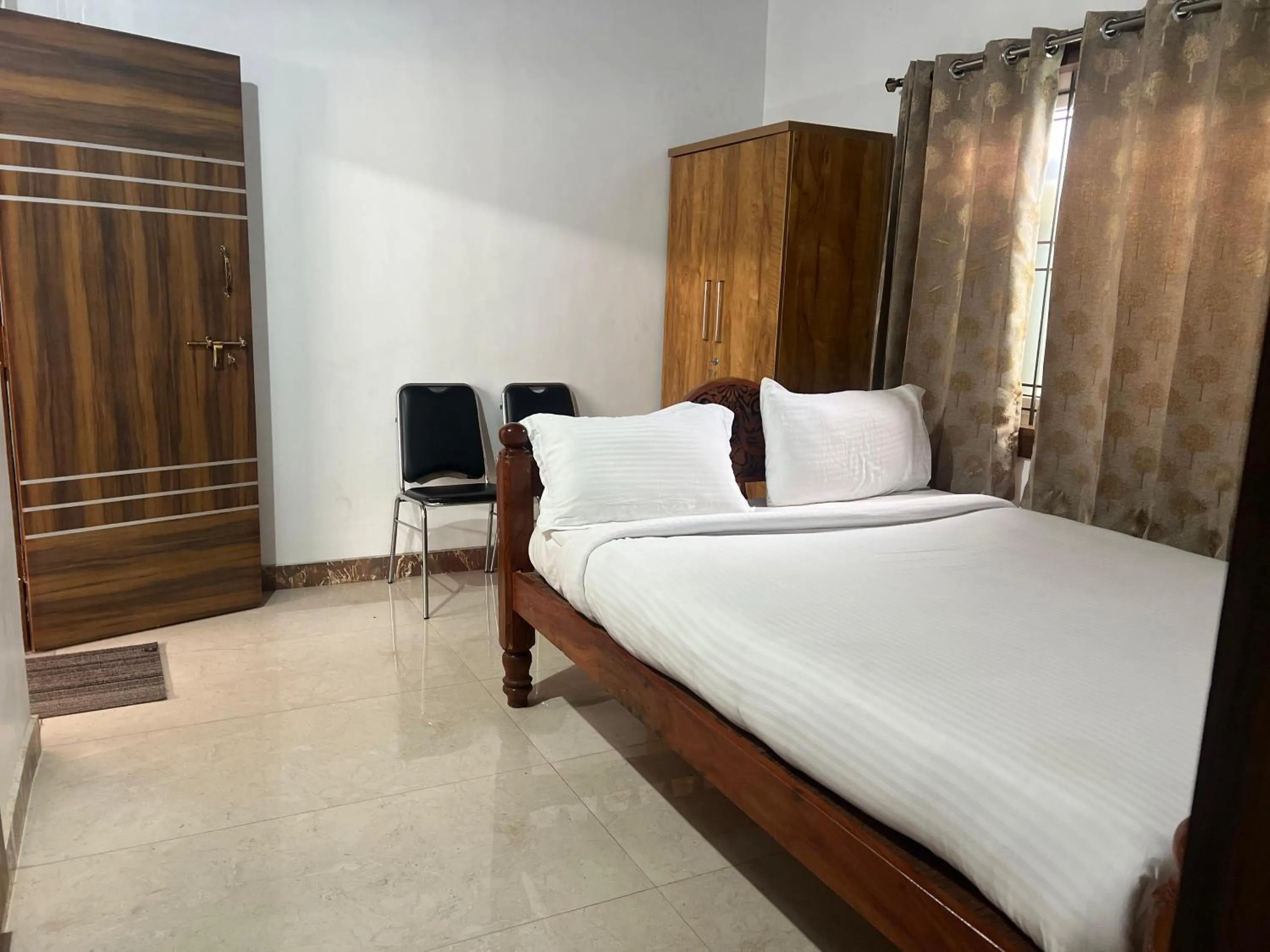 Bed in Poojaris Nirantara - Mysuru