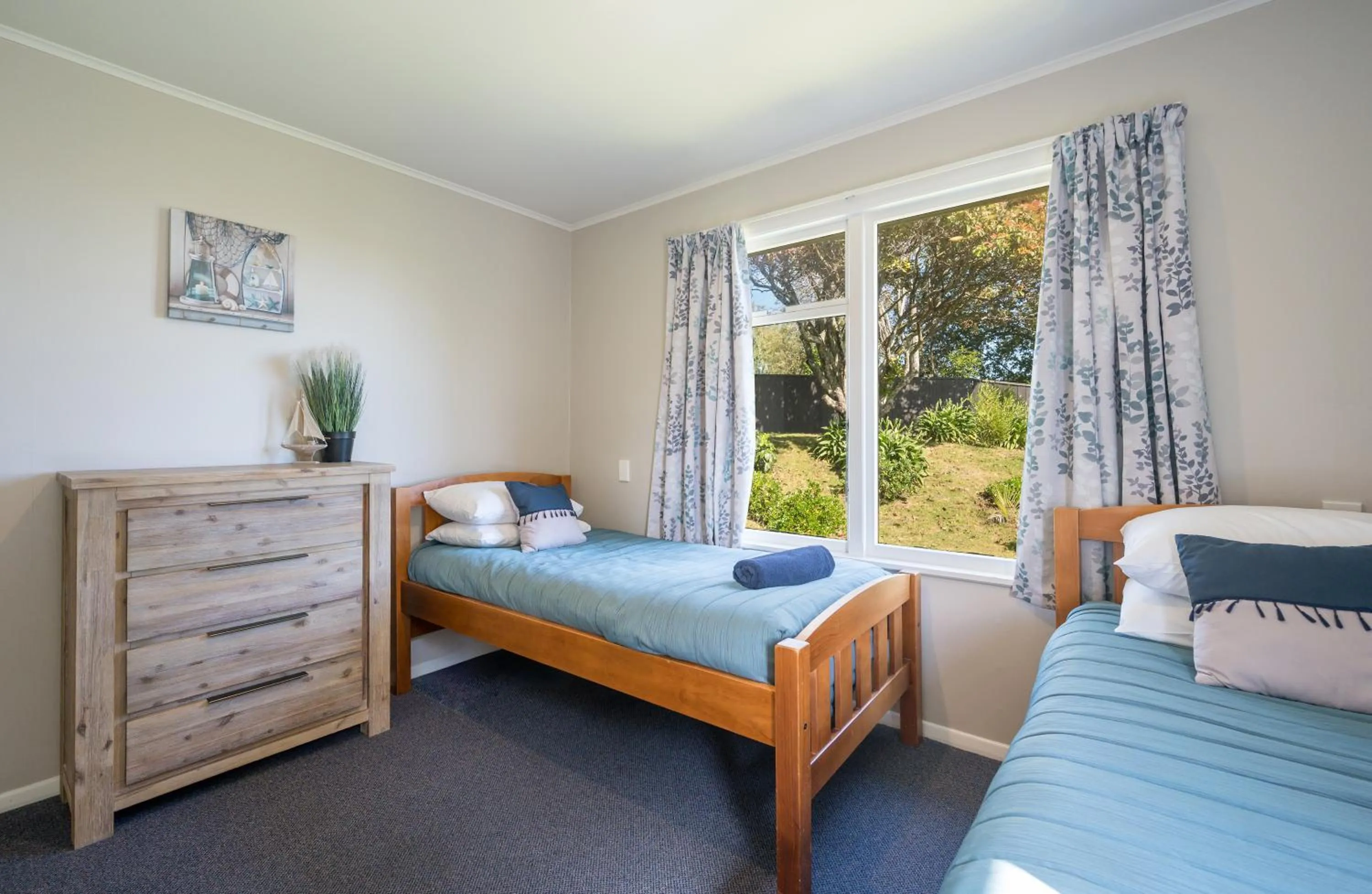 Bed in Tāhuna Beach Holiday Park