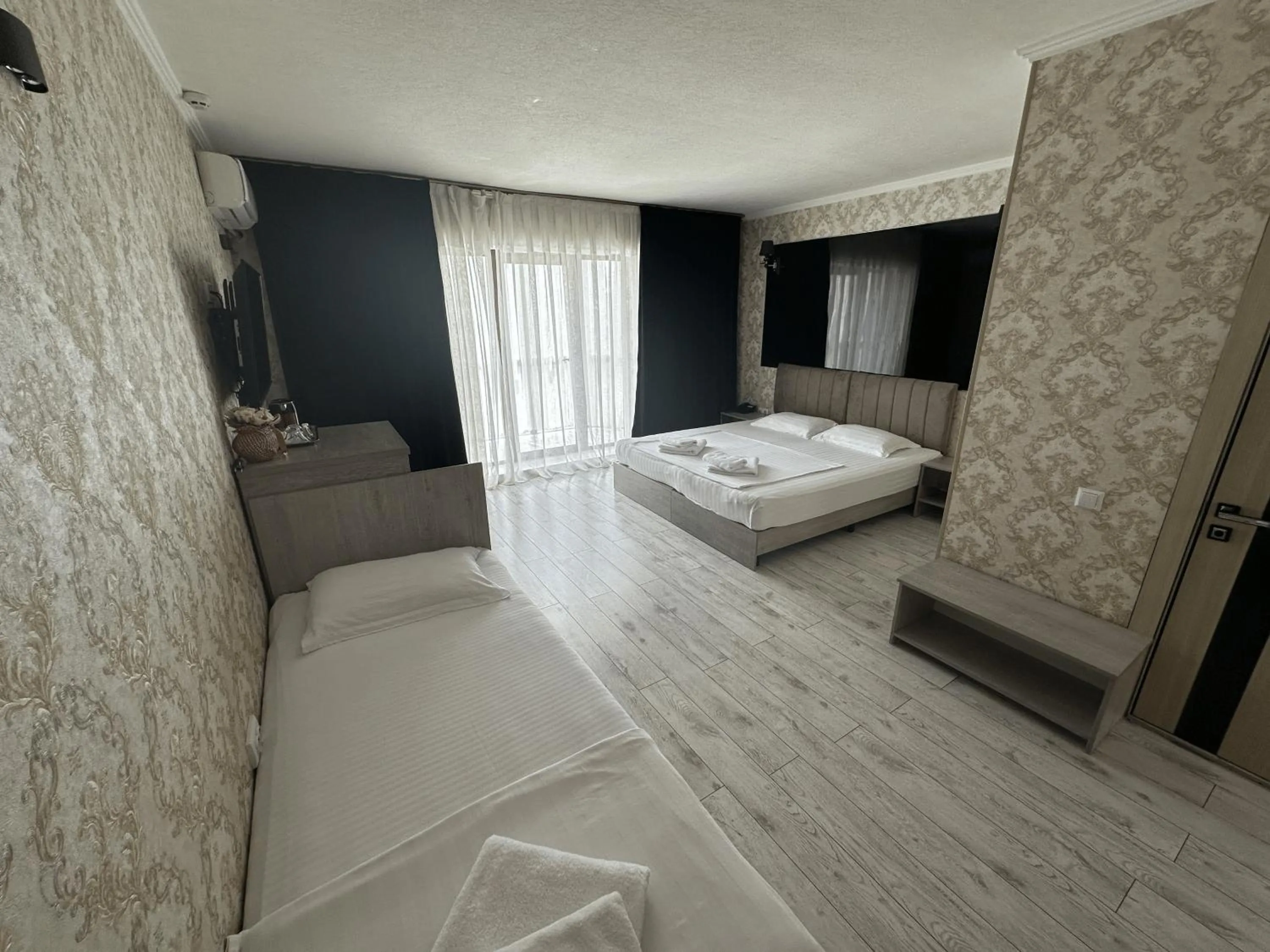 Bed in Artist Regency Hotel