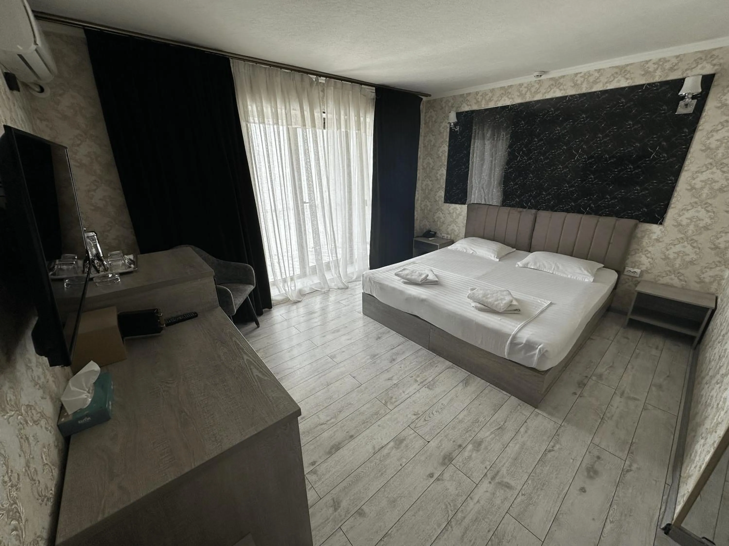 Communal lounge/ TV room in Artist Regency Hotel