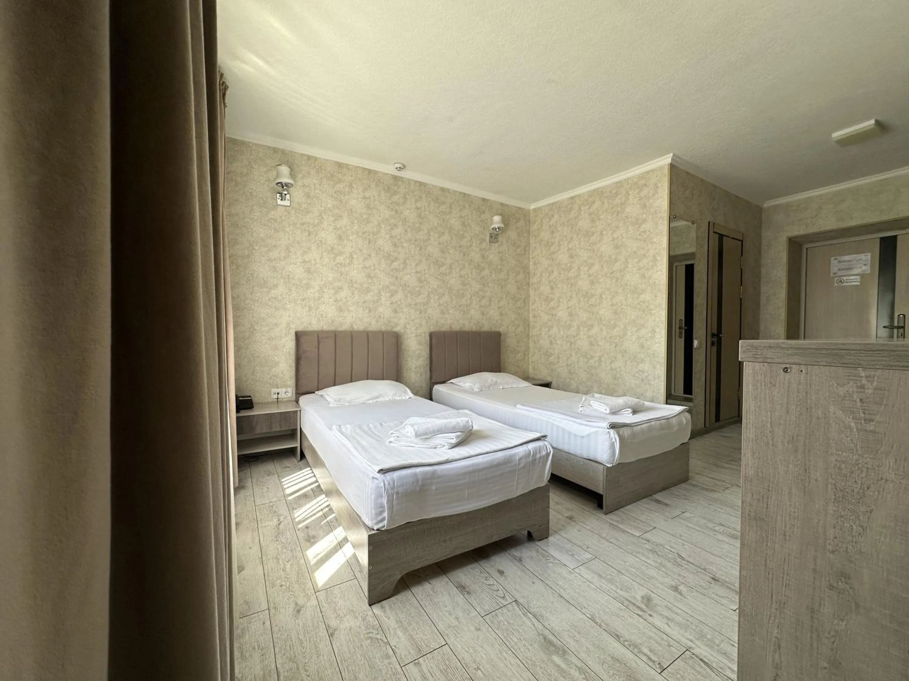 Bed in Artist Regency Hotel