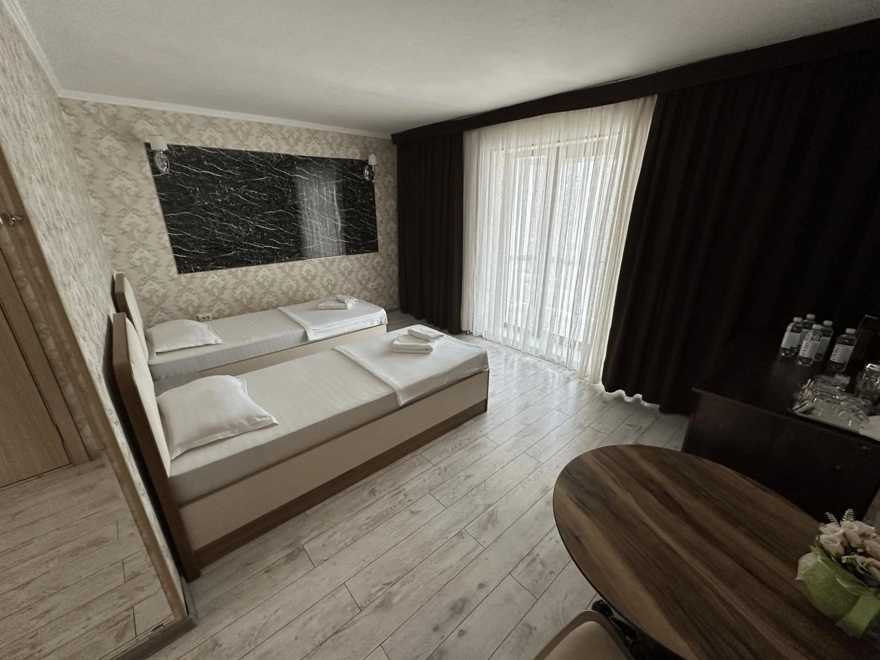 Bed in Artist Regency Hotel