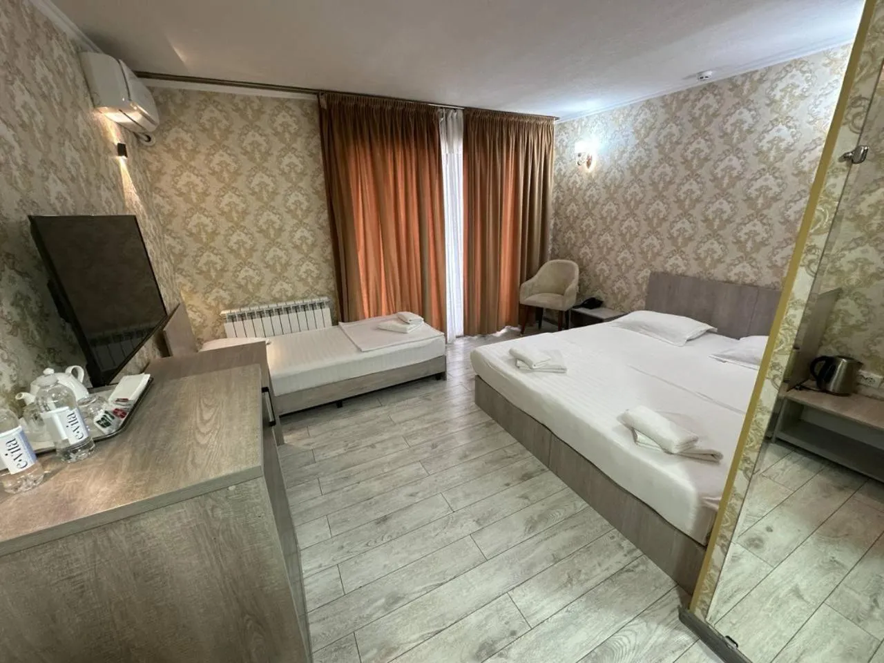 Bed in Artist Regency Hotel