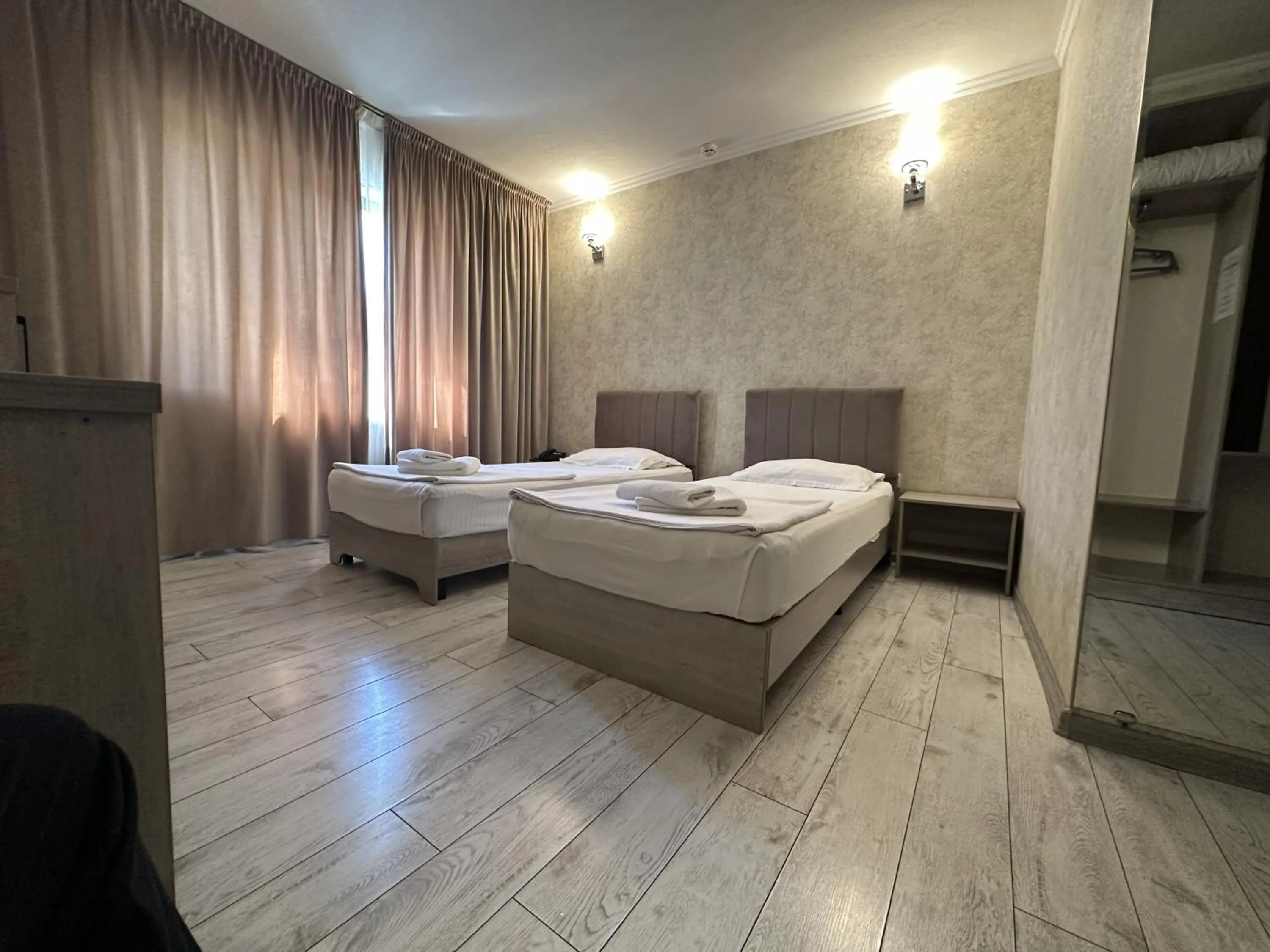 Bed in Artist Regency Hotel