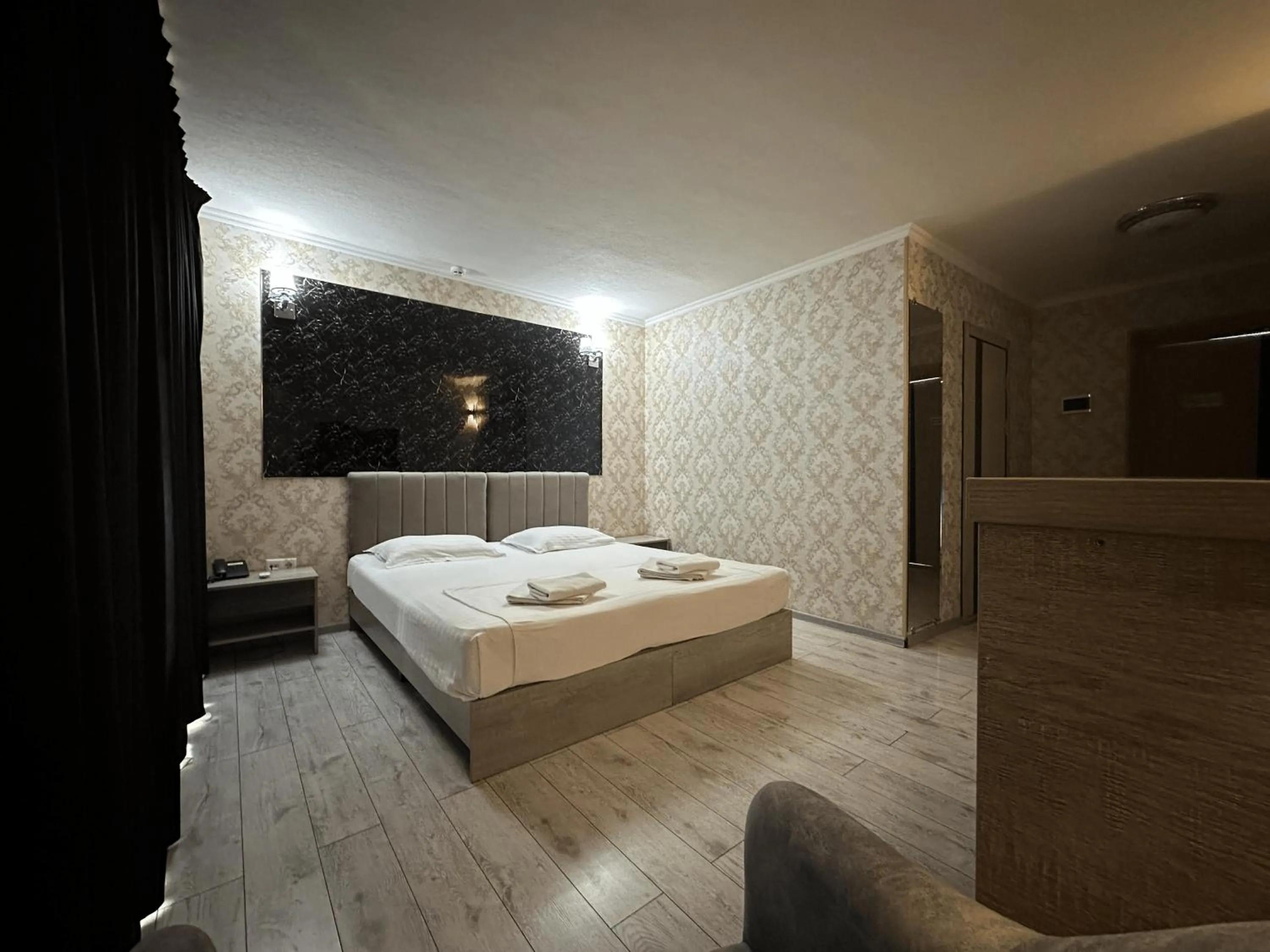 Bed in Artist Regency Hotel