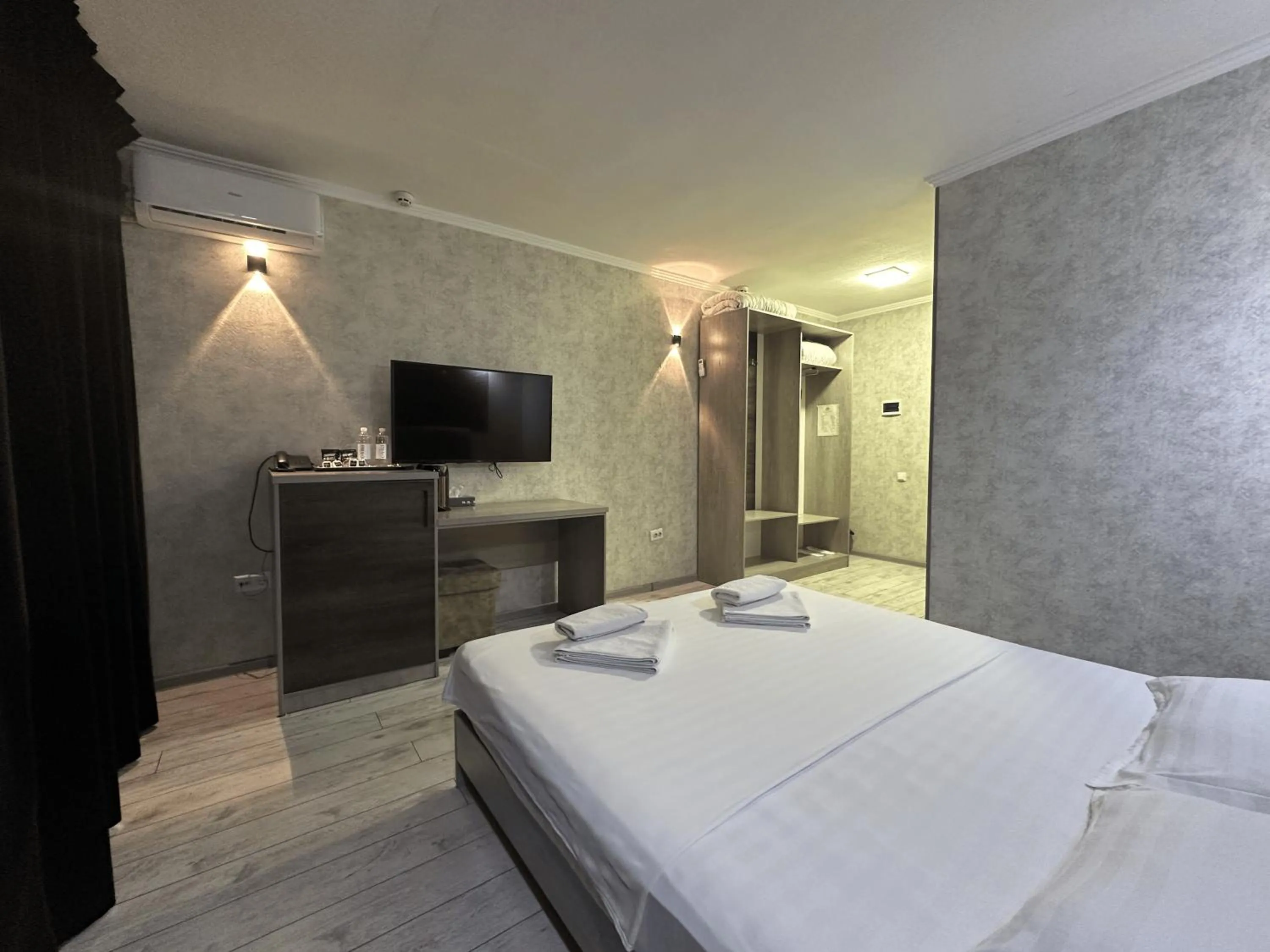 Bed in Artist Regency Hotel